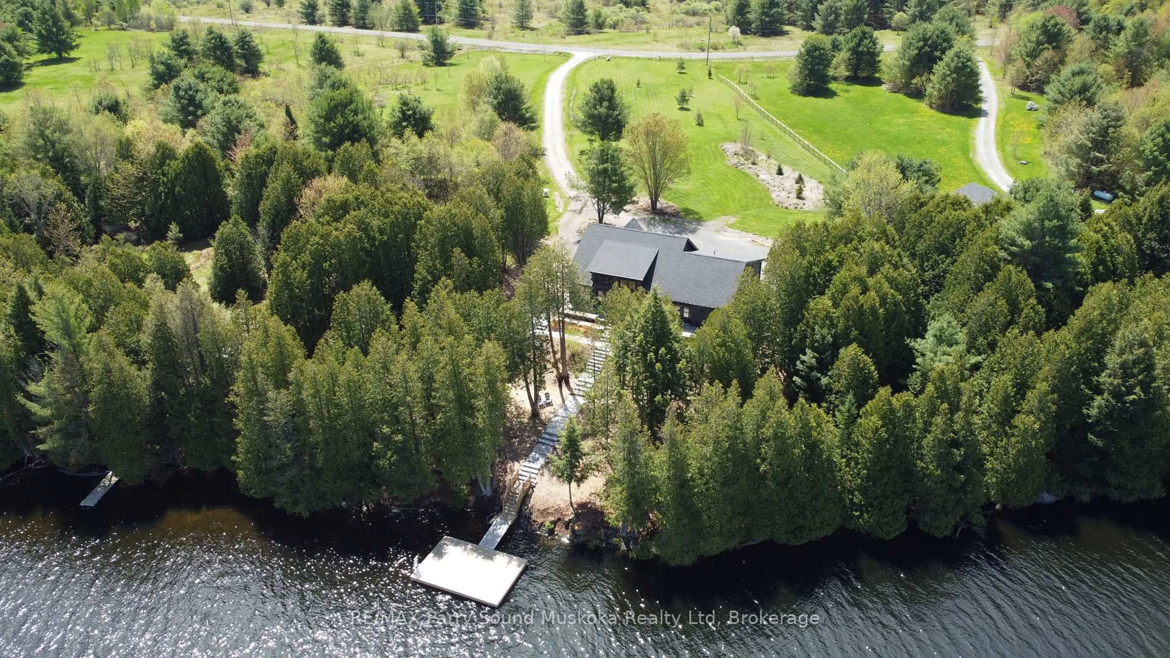 A pic from outside/outdoor area/front of a property/back of a property/a pic from drone, water/lake/river/ocean view for 54 Lake Ridge Rd, Seguin Ontario P0C 1J0
