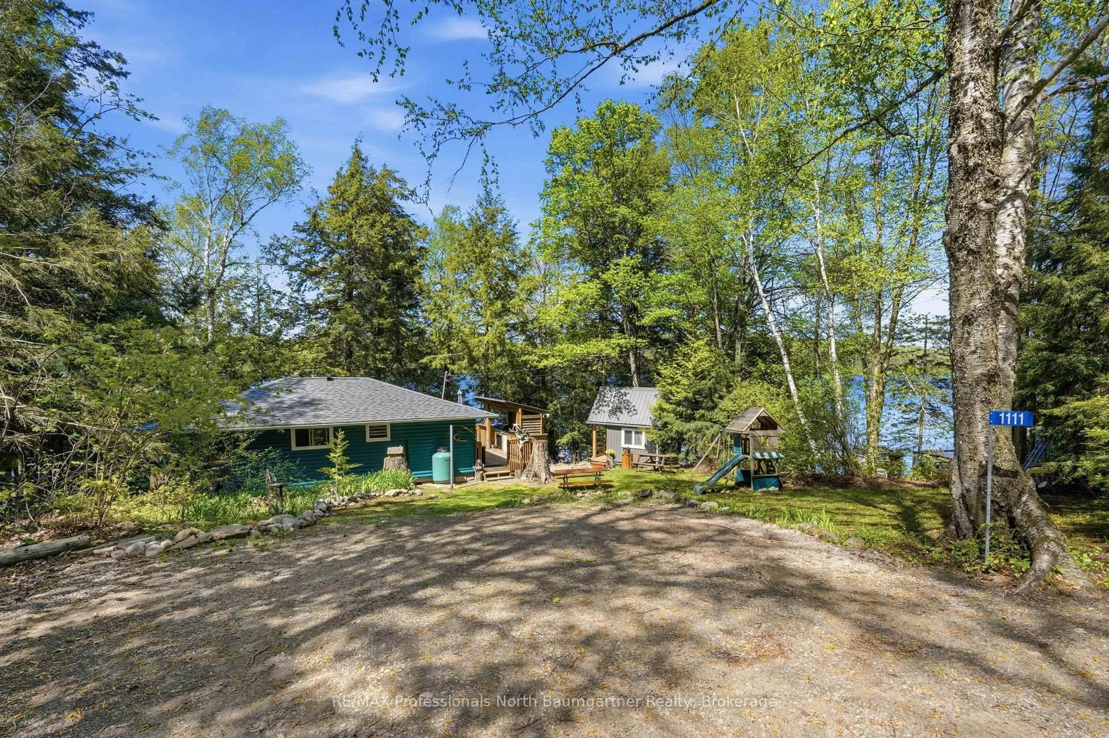 A pic from outside/outdoor area/front of a property/back of a property/a pic from drone, water/lake/river/ocean view for 1111 Corylus Lane, Dysart et al Ontario K0L 1X0