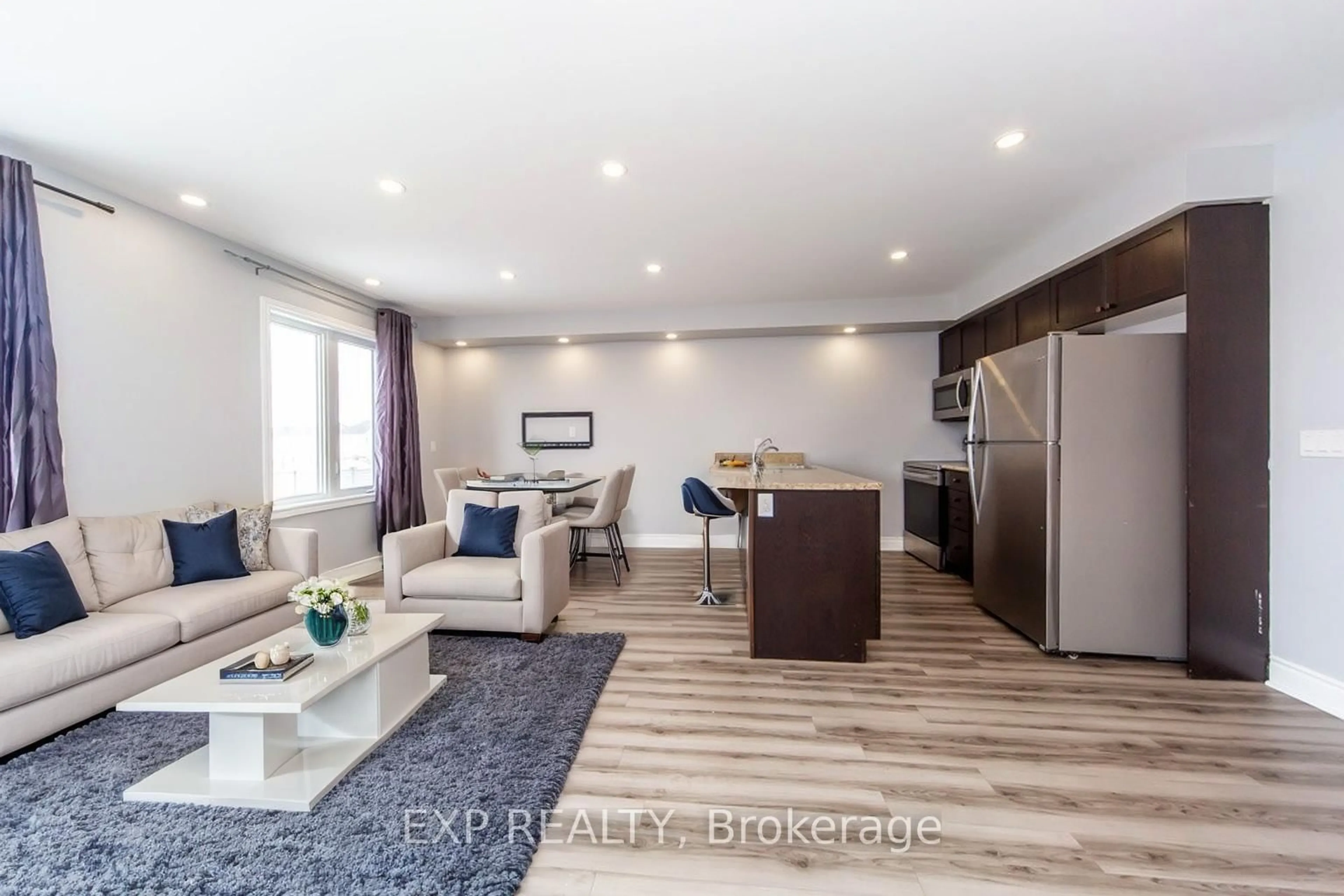 Open concept kitchen, wood/laminate floor for 734 Cook Cres, Shelburne Ontario L9V 3V2