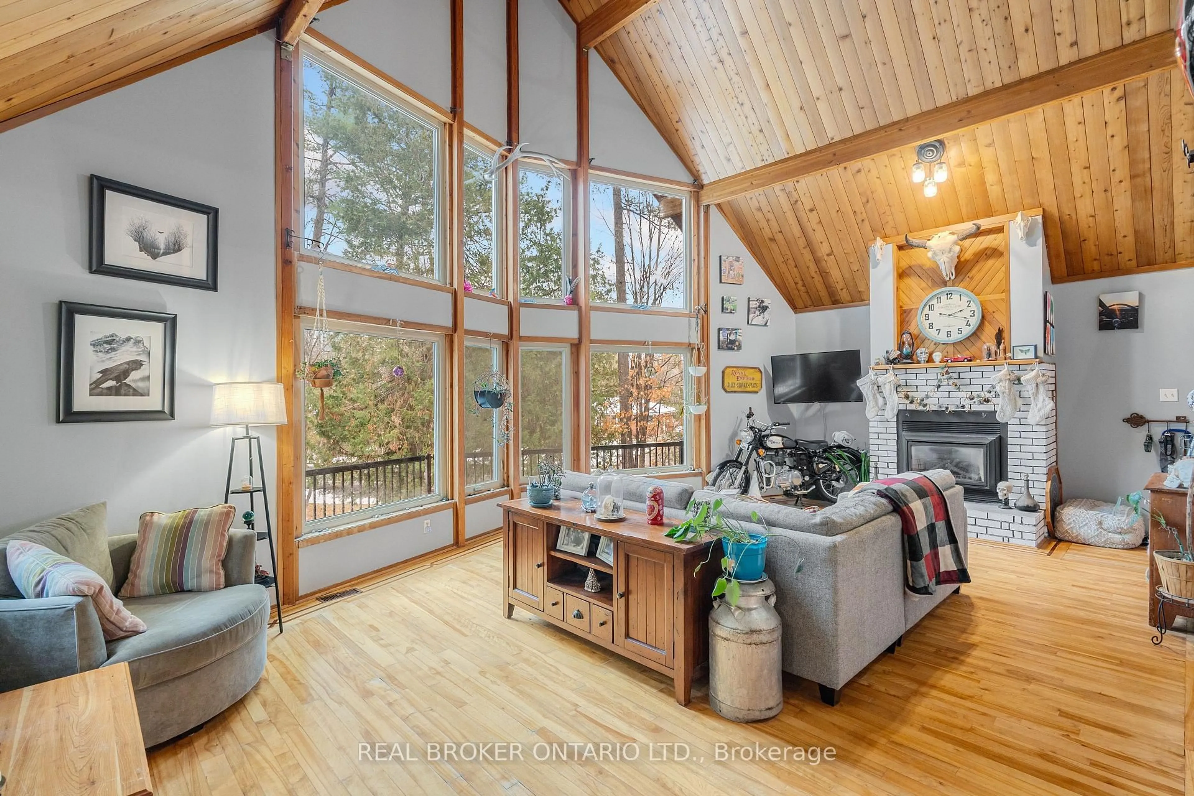 Living room with furniture, wood/laminate floor for 1 Woodland Dr, Braeside Ontario K0A 1G0