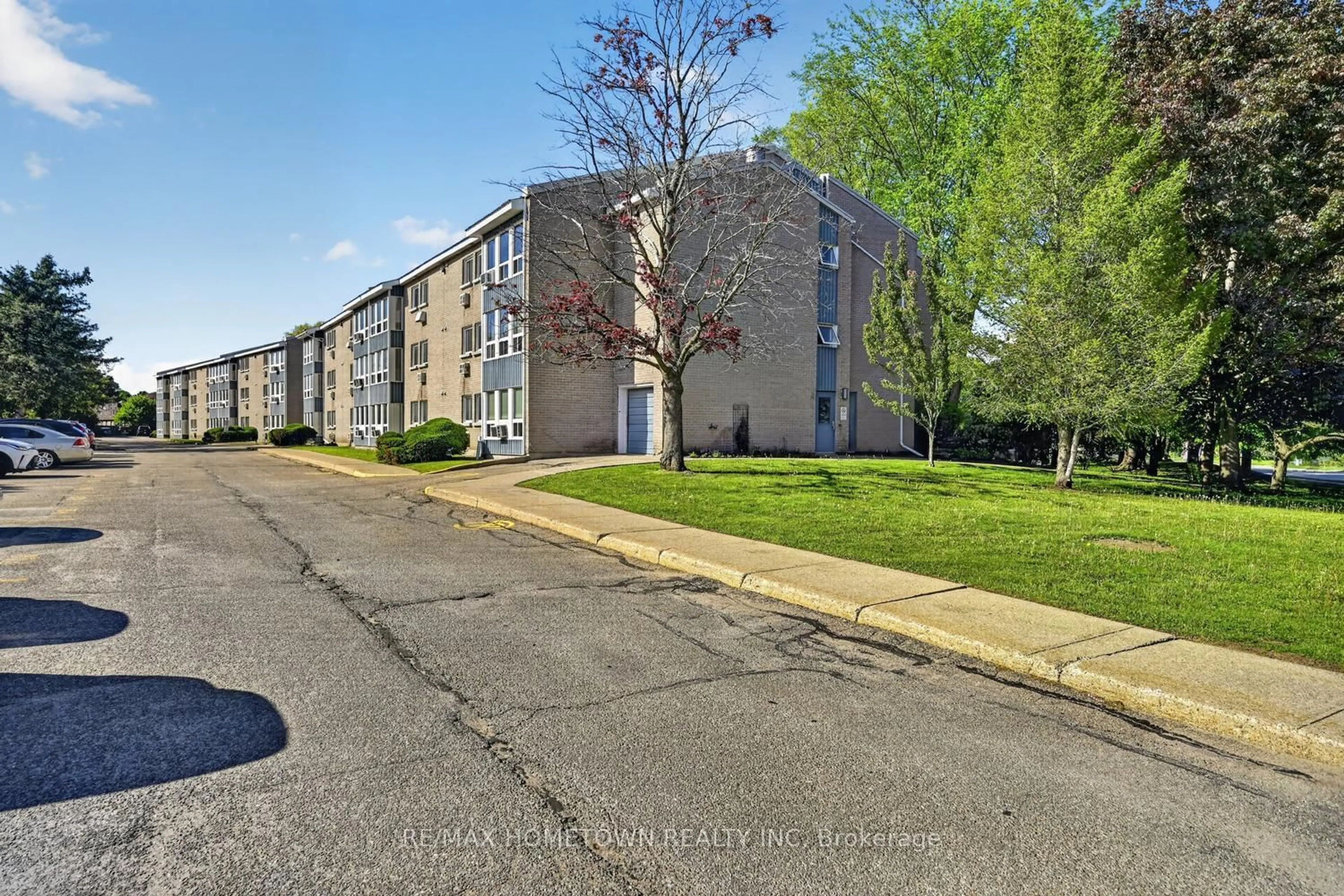 A pic from outside/outdoor area/front of a property/back of a property/a pic from drone, street for 820 Laurier Blvd #304, Brockville Ontario K6V 6Z2