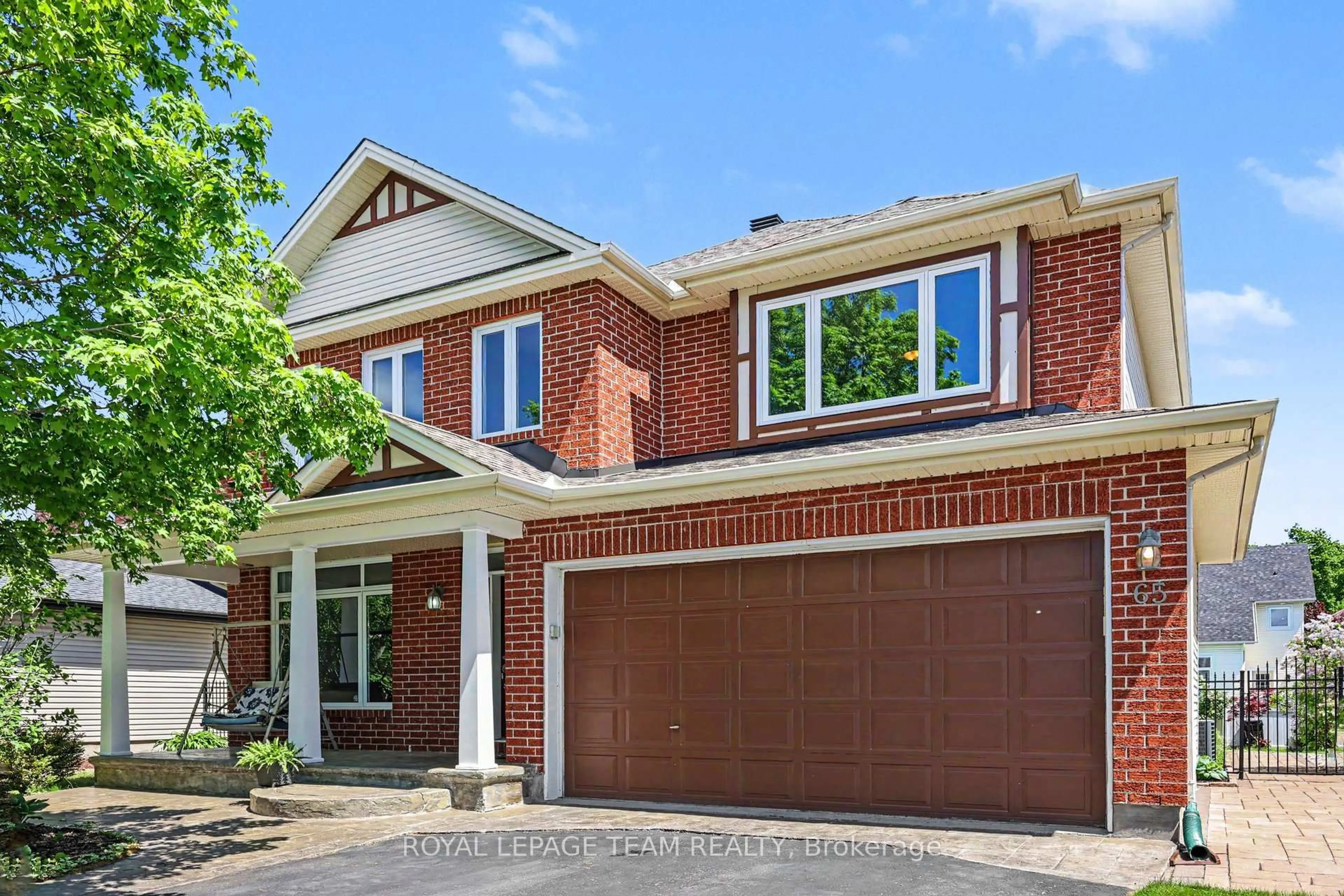 Home with brick exterior material, street for 65 Osprey Cres, Ottawa Ontario K2M 2Z8