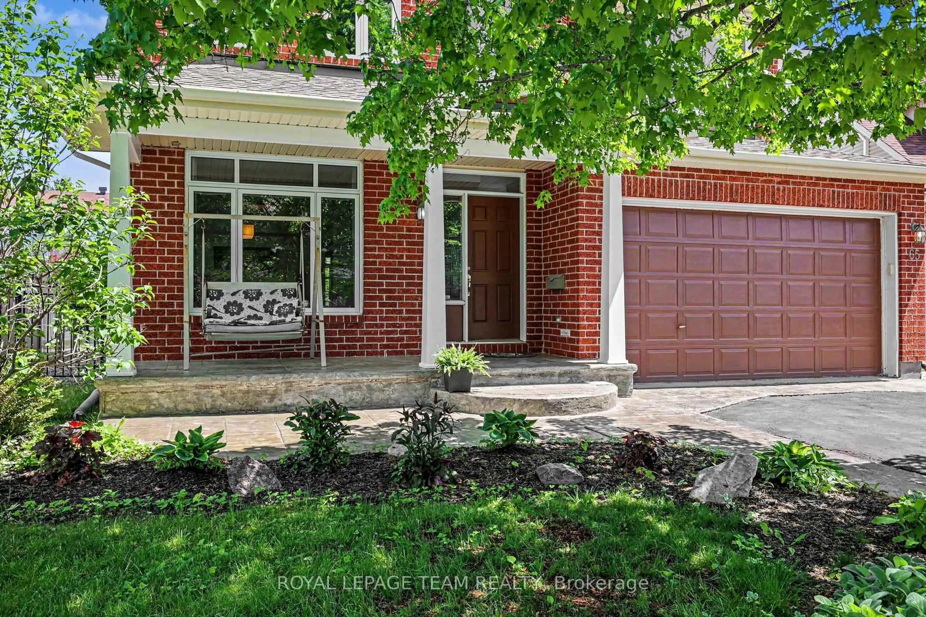 Home with brick exterior material, street for 65 Osprey Cres, Ottawa Ontario K2M 2Z8
