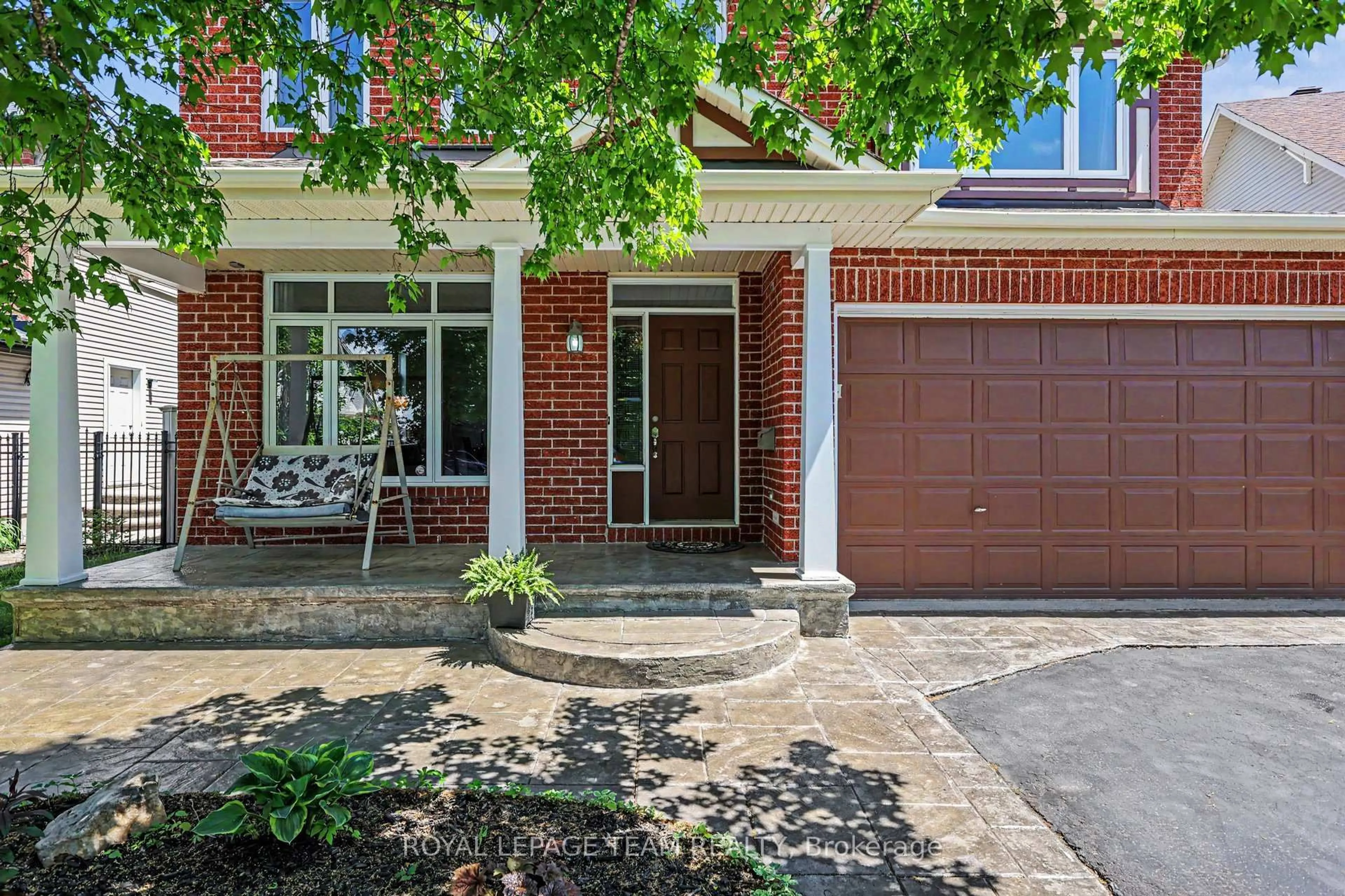 Home with brick exterior material, street for 65 Osprey Cres, Ottawa Ontario K2M 2Z8