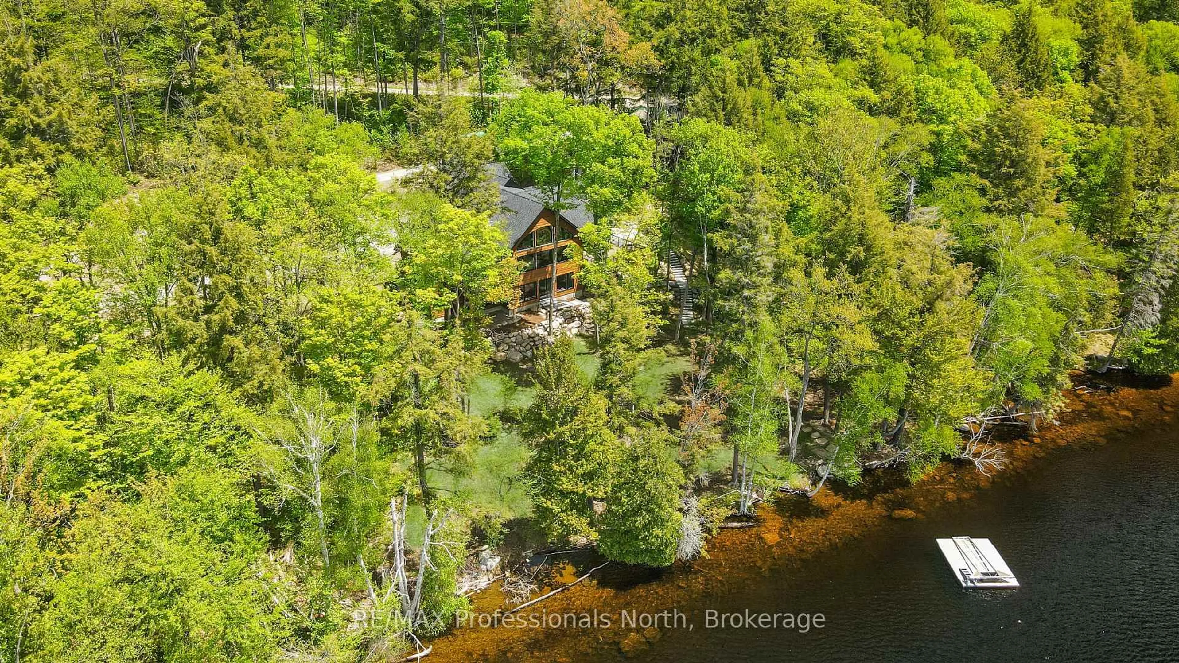 A pic from outside/outdoor area/front of a property/back of a property/a pic from drone, water/lake/river/ocean view for 1320 Flatwater Cove Tr, Dysart et al Ontario K0M 1S0