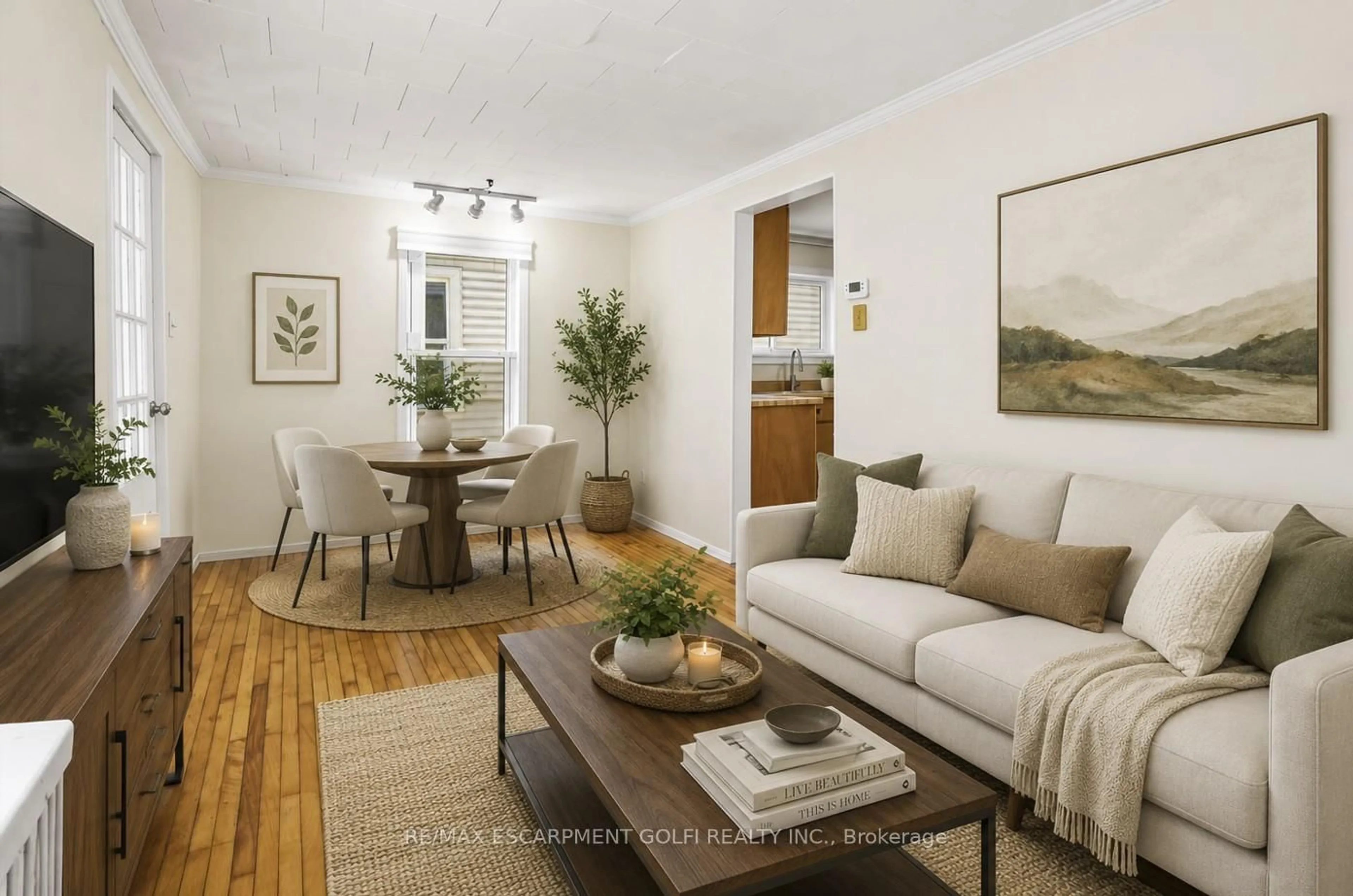 Living room with furniture, wood/laminate floor for 15 Kent St, Welland Ontario L3B 3G9