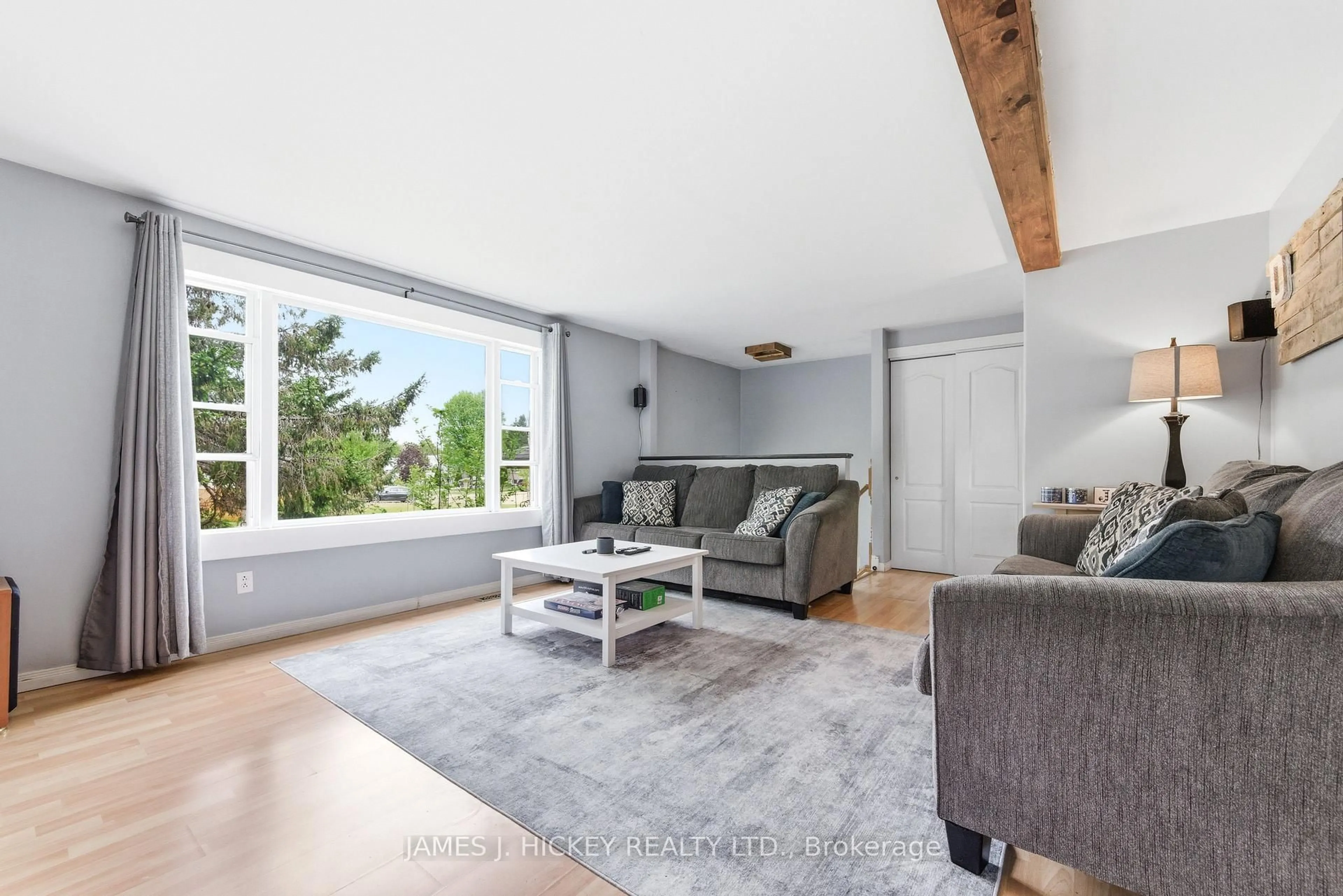 Living room with furniture, wood/laminate floor for 1 Tamarack St, Deep River Ontario K0J 1P0