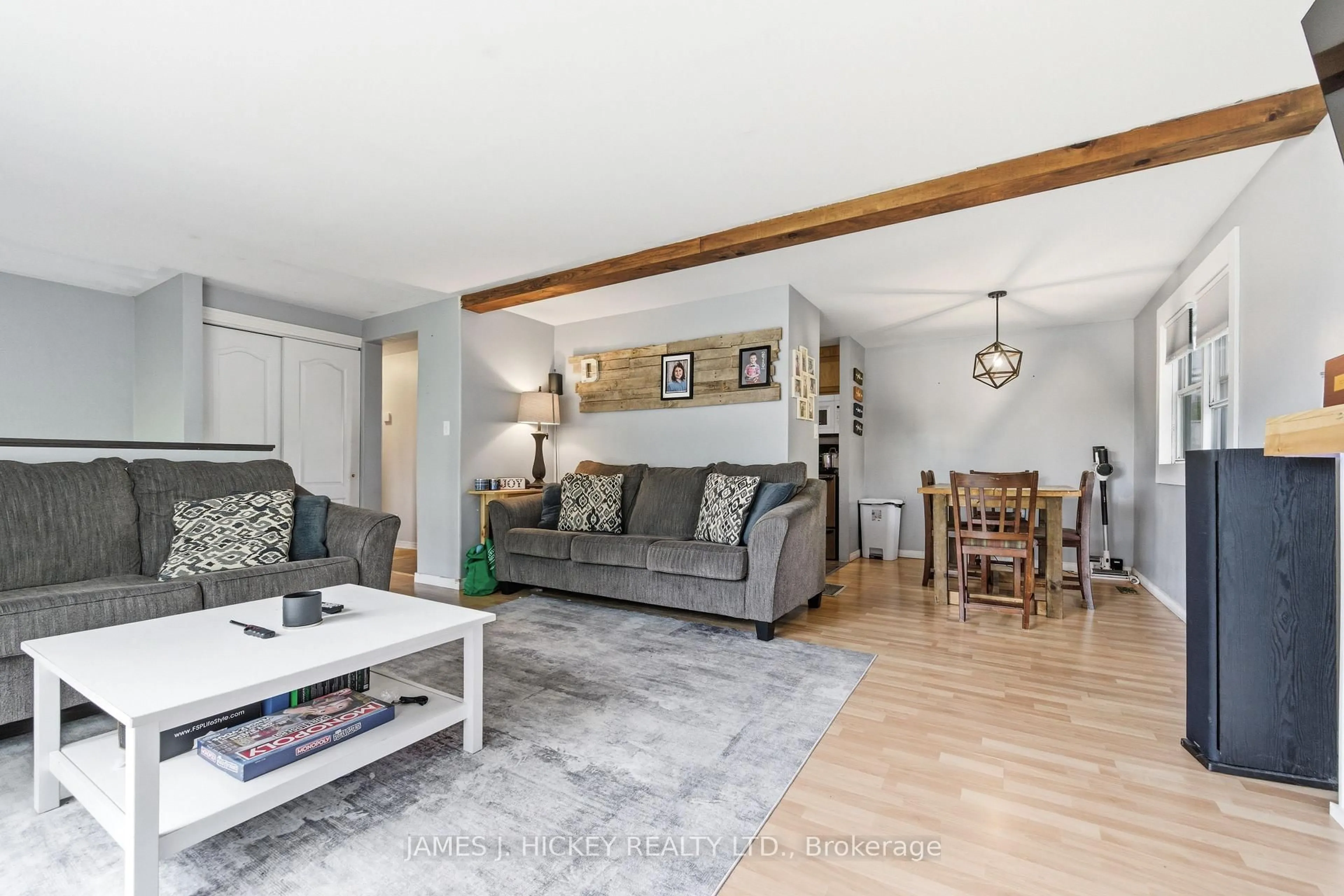 Living room with furniture, wood/laminate floor for 1 Tamarack St, Deep River Ontario K0J 1P0