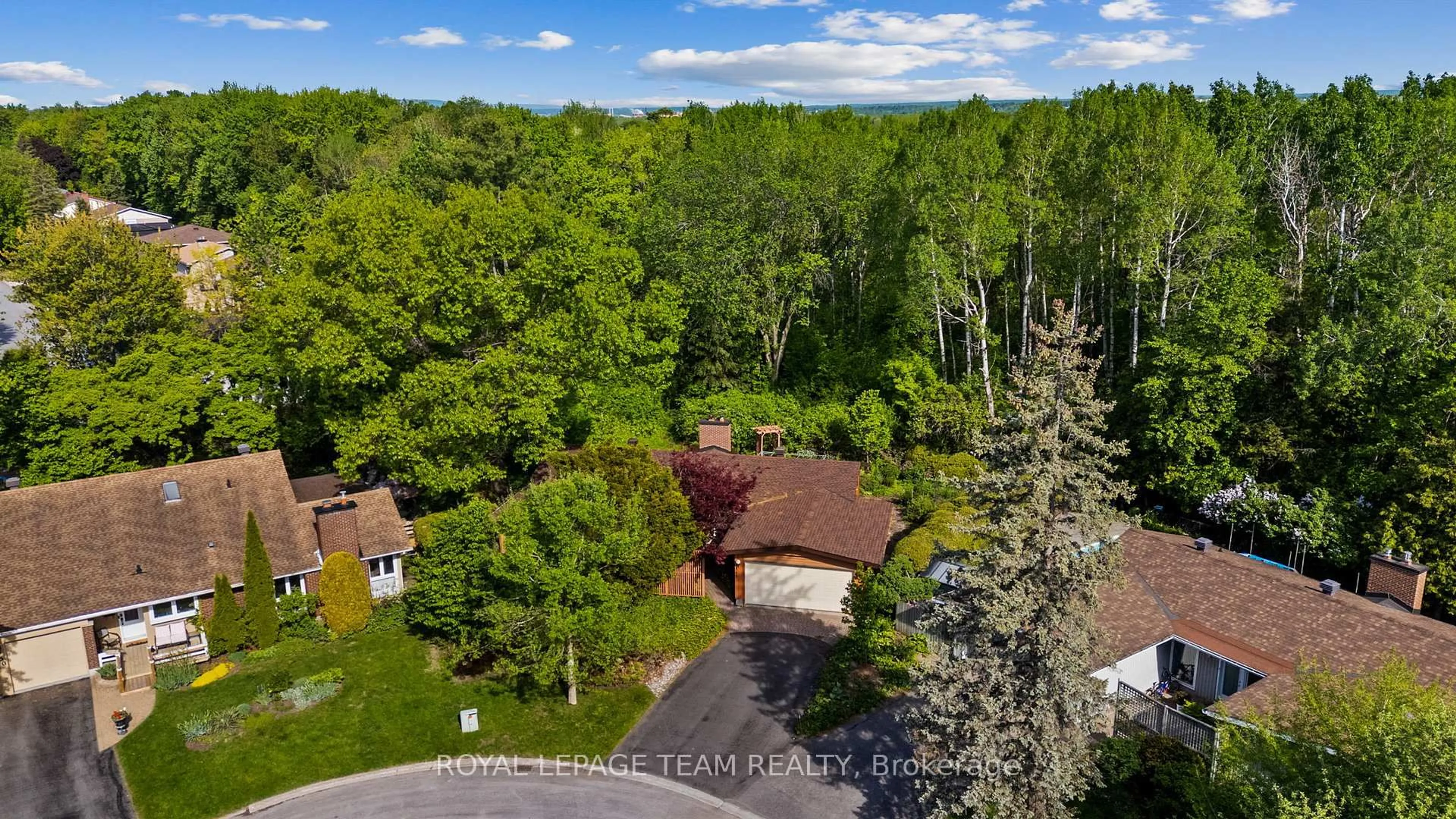 A pic from outside/outdoor area/front of a property/back of a property/a pic from drone, forest/trees view for 548 Rivershore Cres, Ottawa Ontario K1J 7Y7