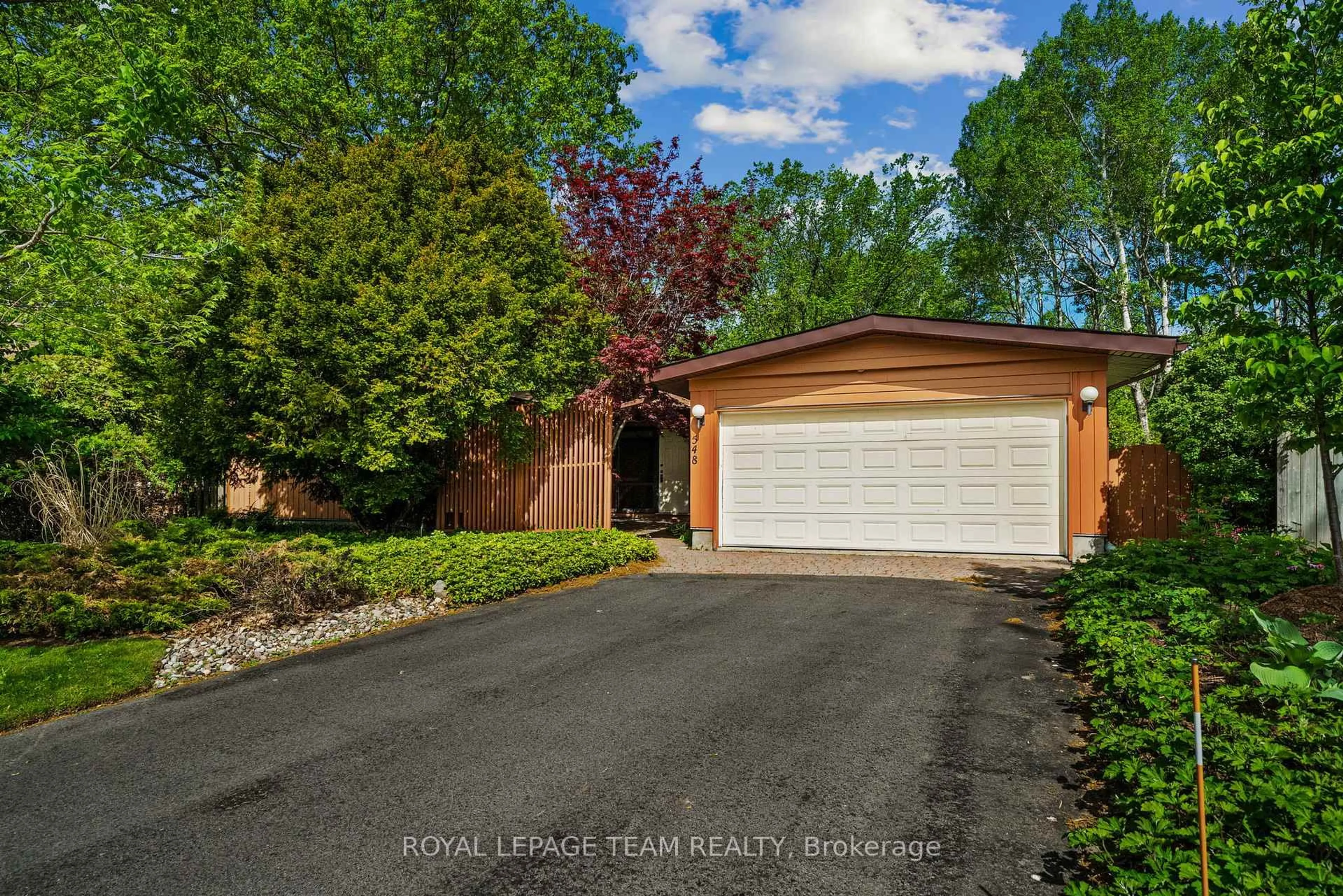 Home with brick exterior material, street for 548 Rivershore Cres, Ottawa Ontario K1J 7Y7