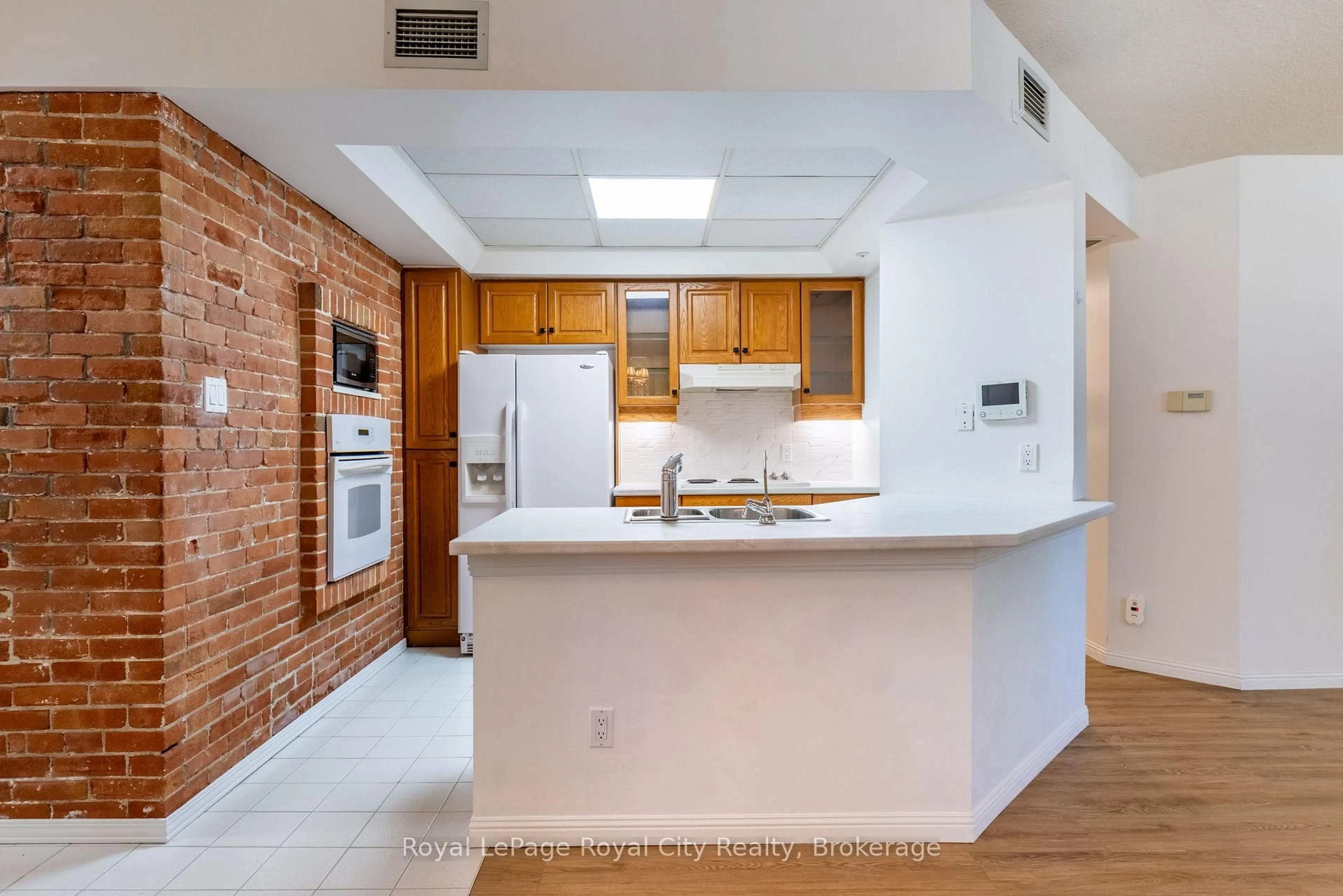 Open concept kitchen, ceramic/tile floor for 57 Suffolk St #101, Guelph Ontario N1H 2J1