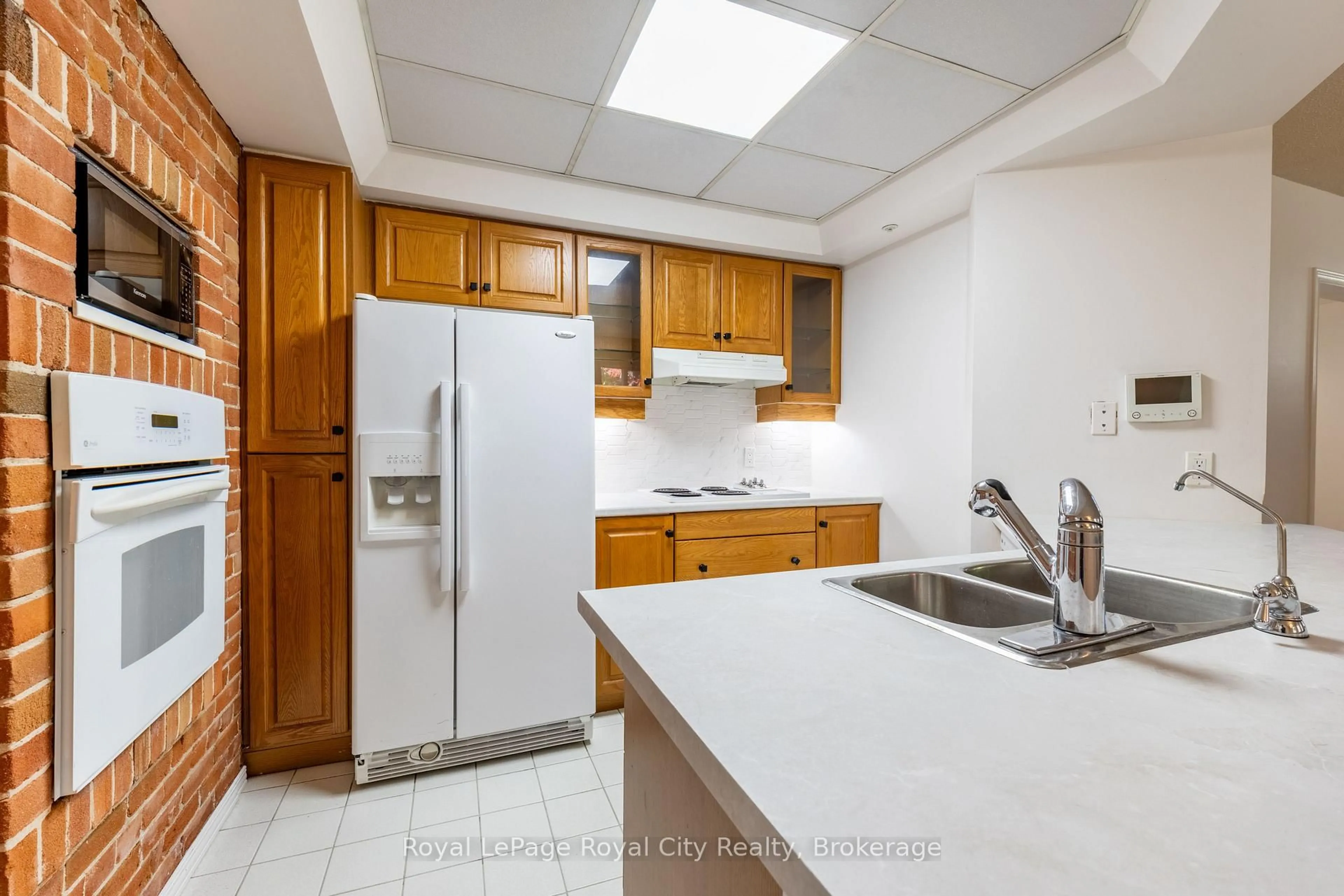 Standard kitchen, ceramic/tile floor for 57 Suffolk St #101, Guelph Ontario N1H 2J1