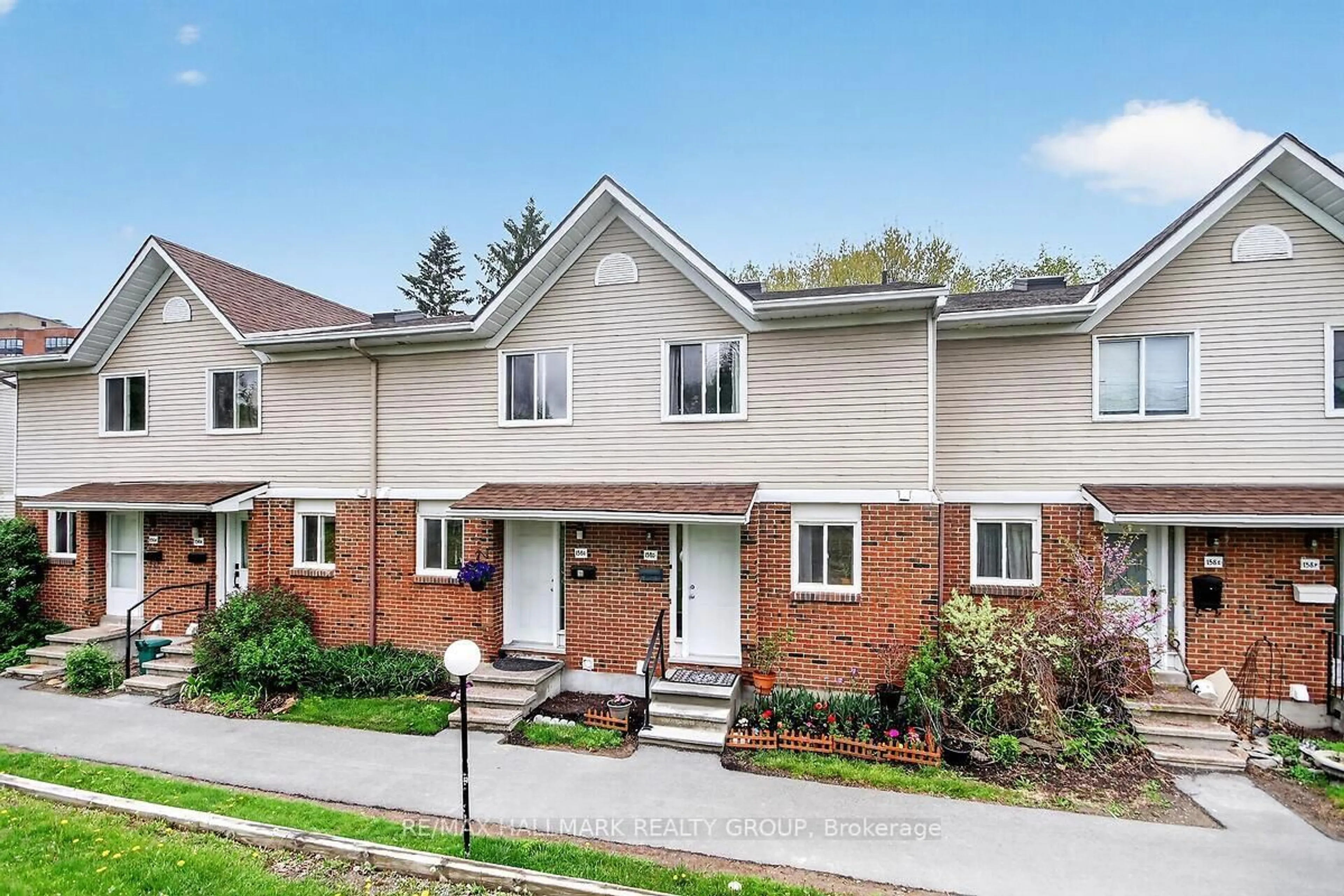 Home with brick exterior material, street for 158 Valley Stream Dr #D, Ottawa Ontario K2H 9C6