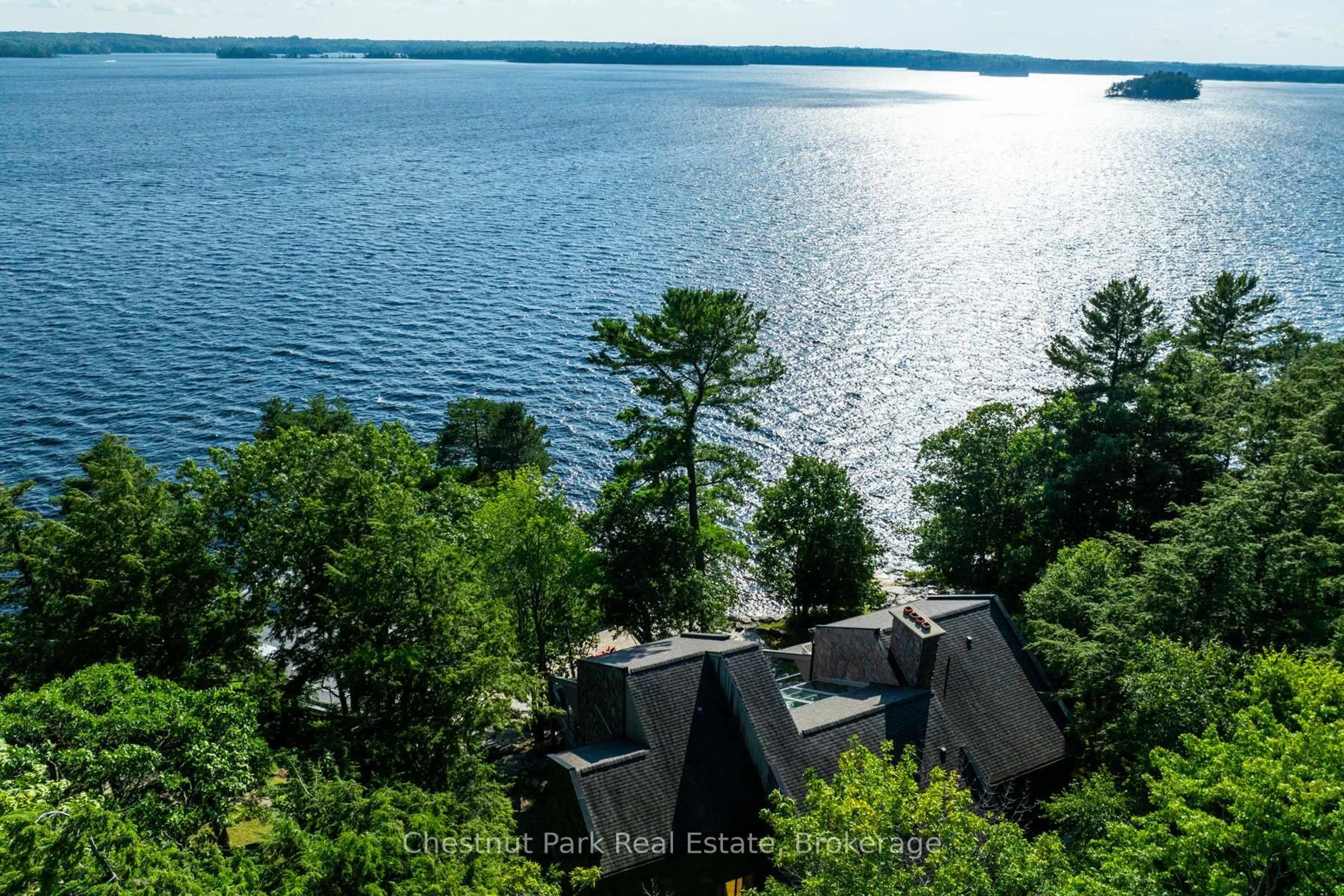 A pic from outside/outdoor area/front of a property/back of a property/a pic from drone, water/lake/river/ocean view for 10 Wyldewood Rd, Muskoka Lakes Ontario P1L 1W8