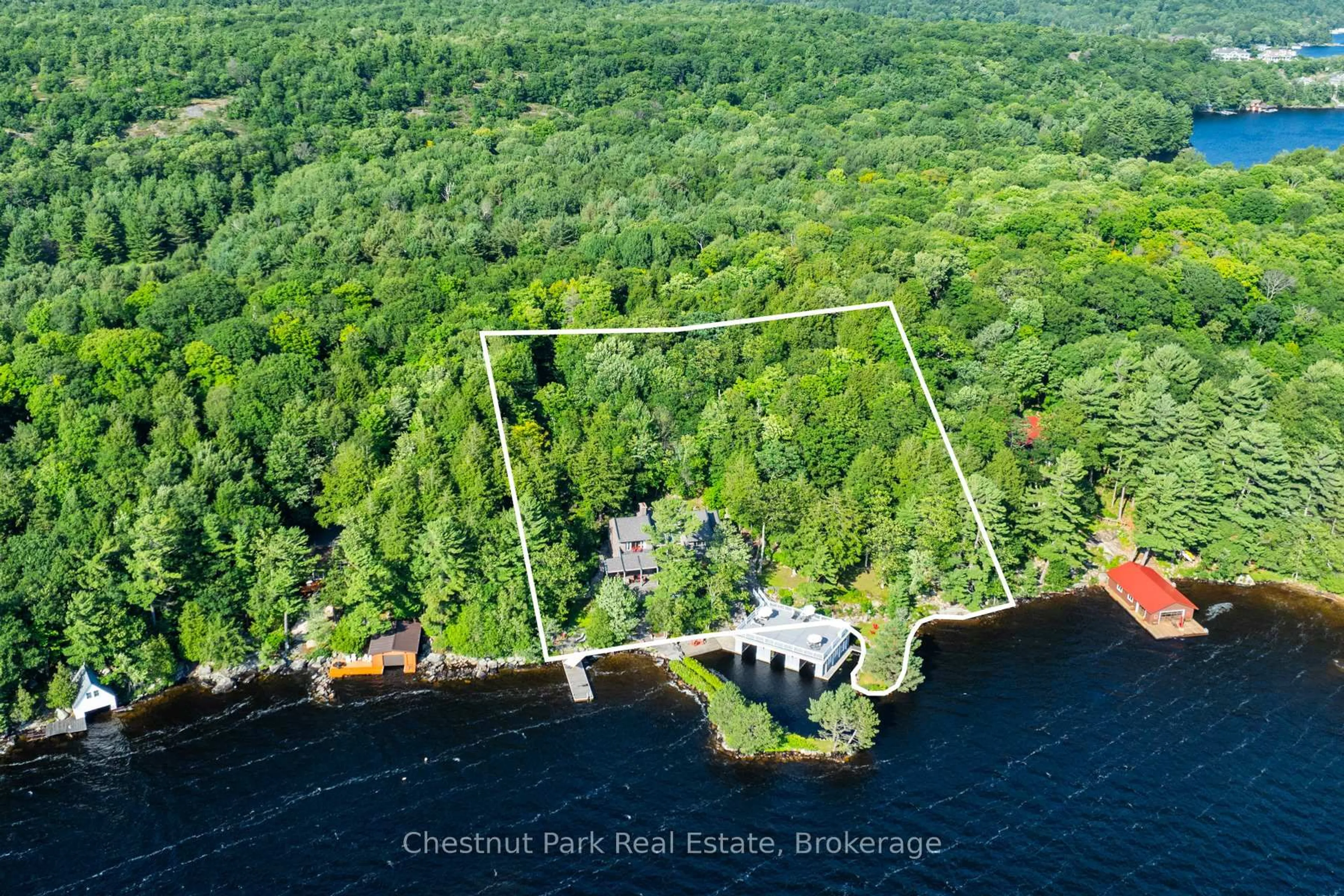 A pic from outside/outdoor area/front of a property/back of a property/a pic from drone, water/lake/river/ocean view for 10 Wyldewood Rd, Muskoka Lakes Ontario P1L 1W8