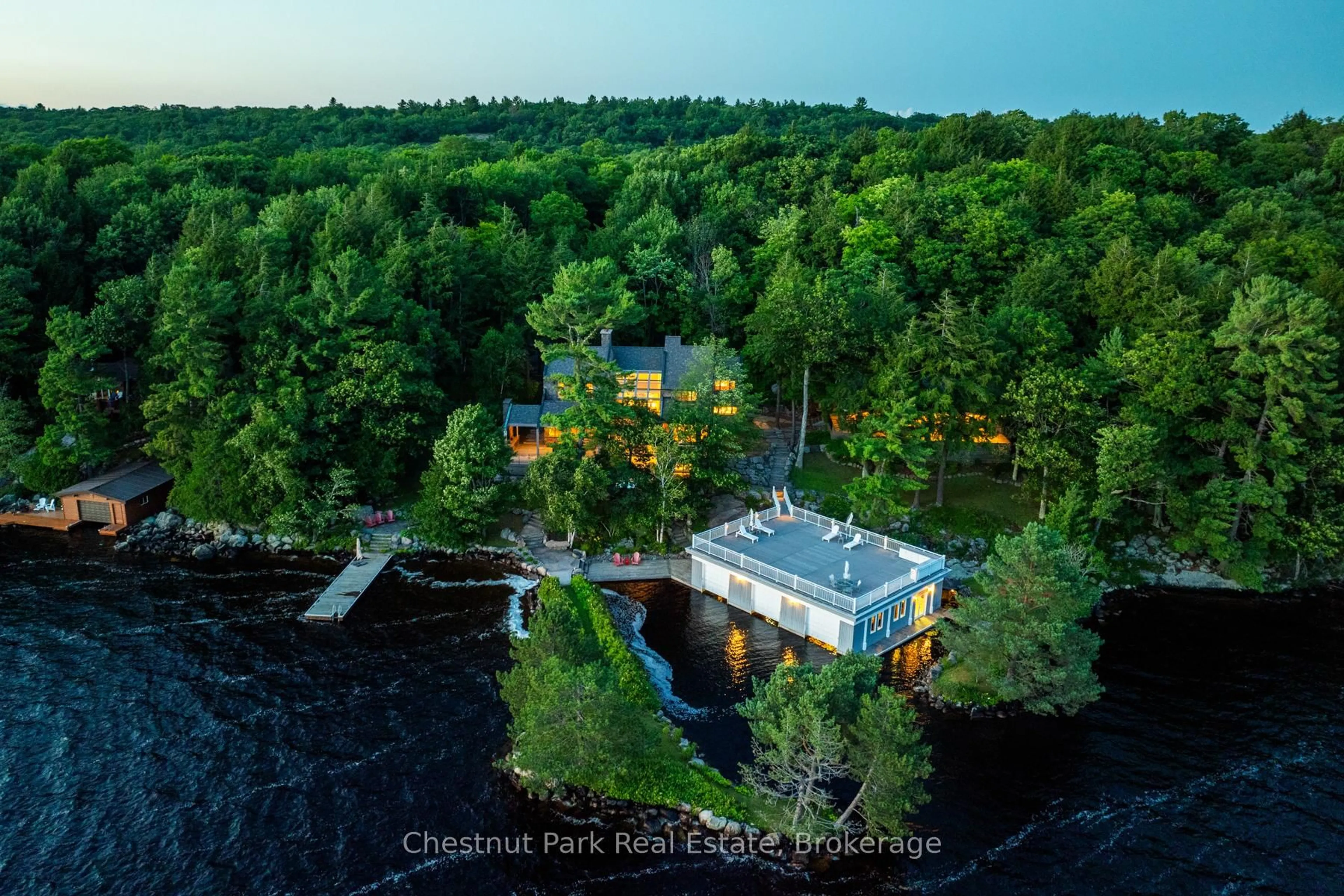 A pic from outside/outdoor area/front of a property/back of a property/a pic from drone, water/lake/river/ocean view for 10 Wyldewood Rd, Muskoka Lakes Ontario P1L 1W8