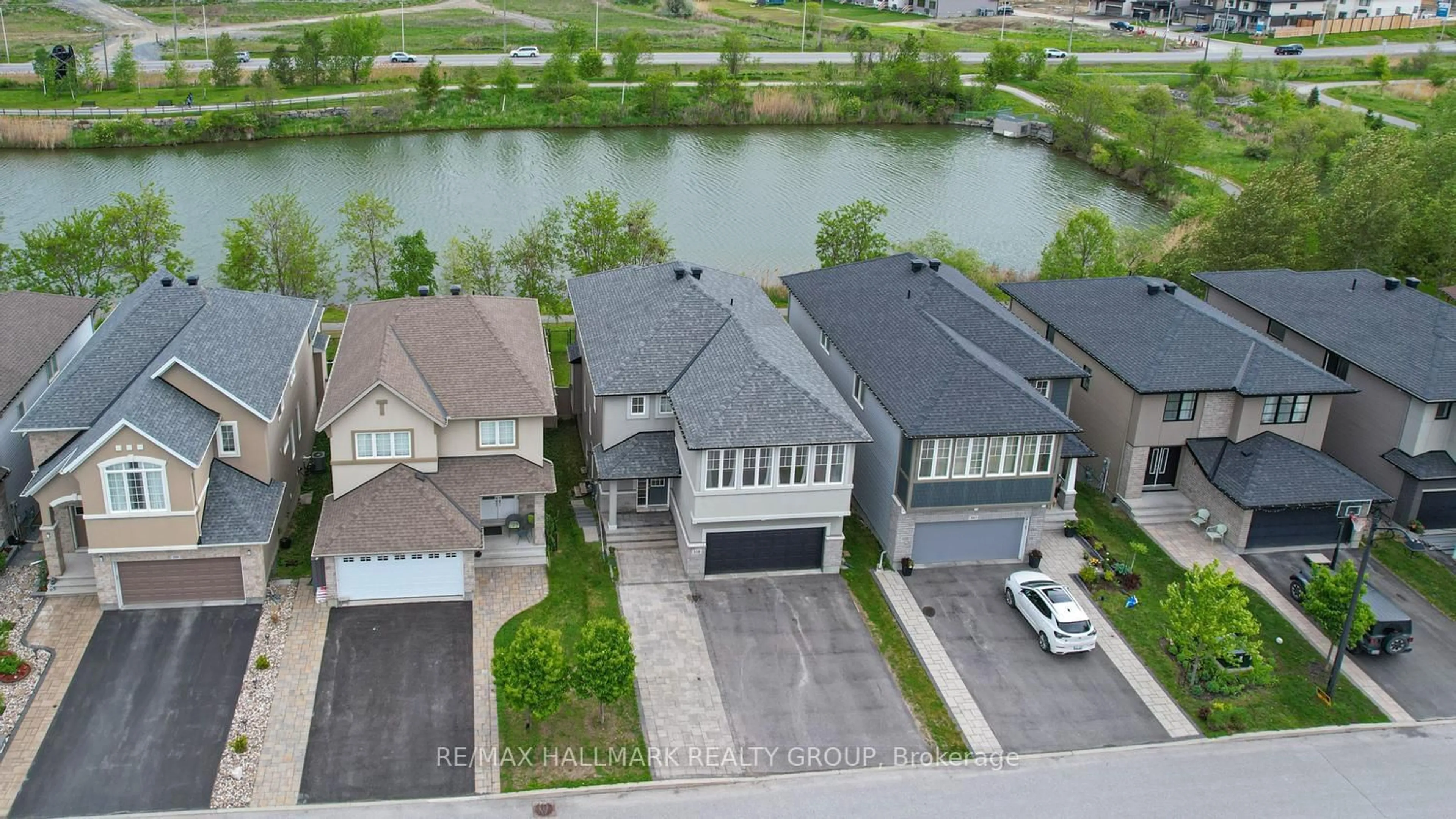 A pic from outside/outdoor area/front of a property/back of a property/a pic from drone, water/lake/river/ocean view for 339 Andalusian Cres, Ottawa Ontario K2V 0C2
