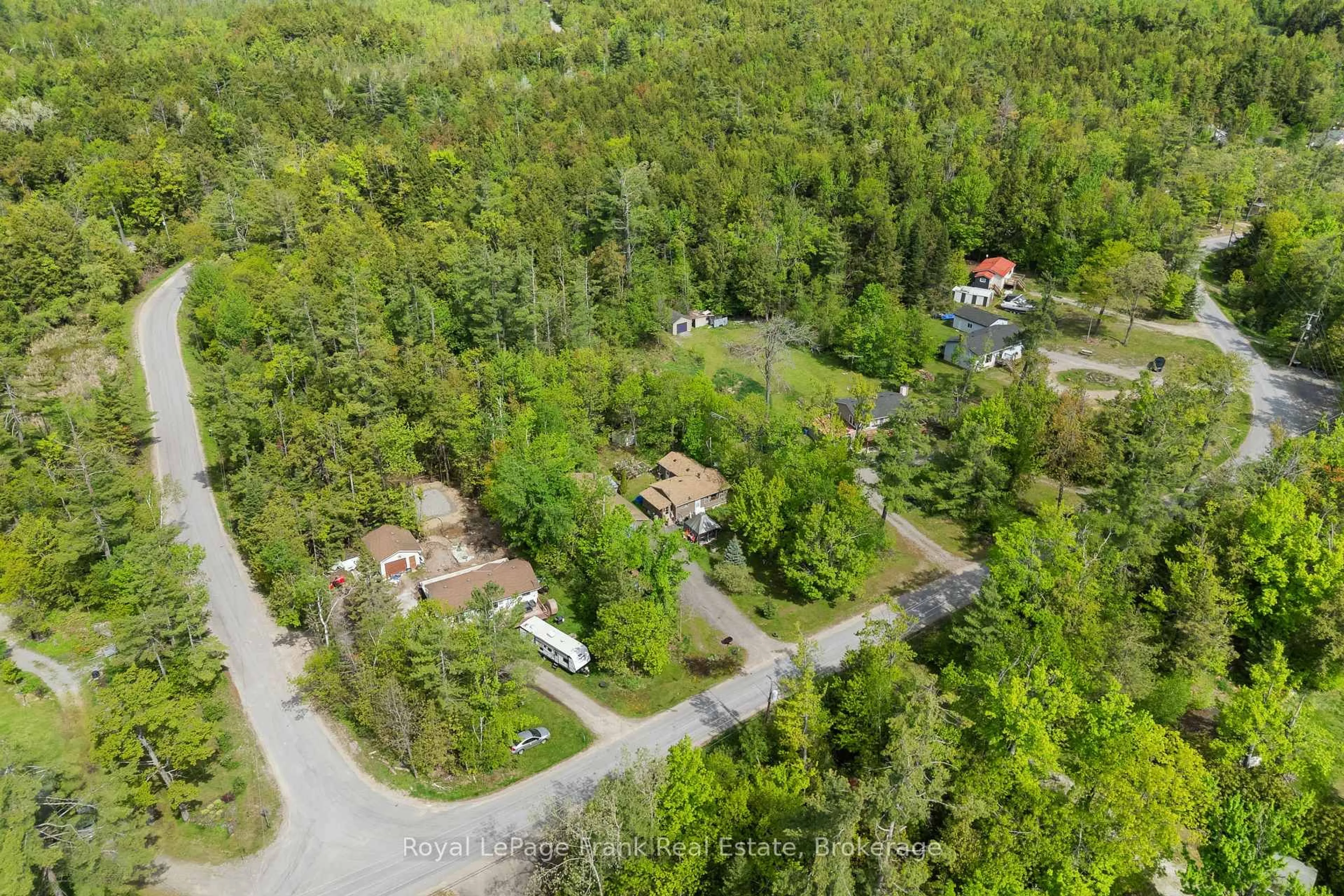 A pic from outside/outdoor area/front of a property/back of a property/a pic from drone, forest/trees view for 454 Kennedy Dr, Trent Lakes Ontario K0M 1A0