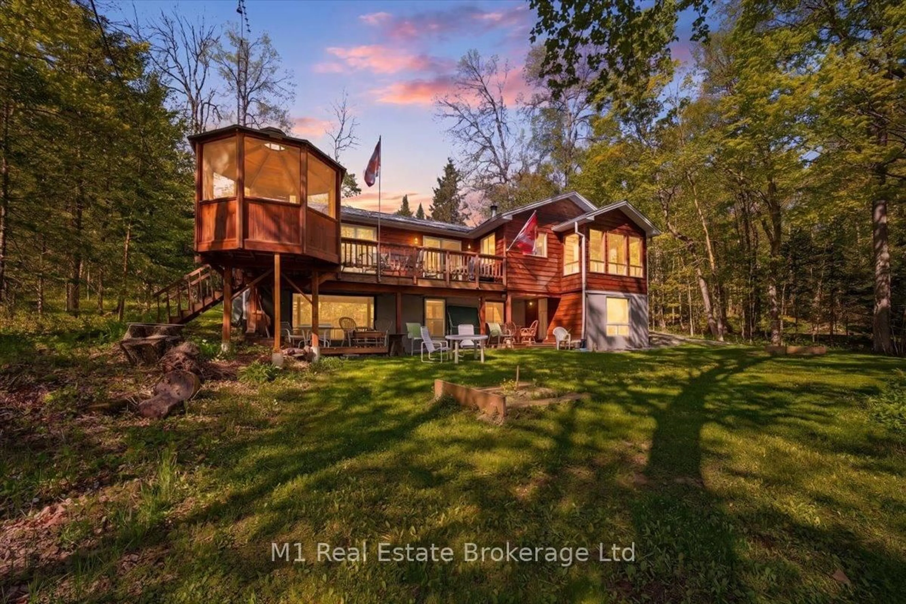 A pic from outside/outdoor area/front of a property/back of a property/a pic from drone, water/lake/river/ocean view for 1099 Sherwood Frst Rd, Bracebridge Ontario P1L 1X3