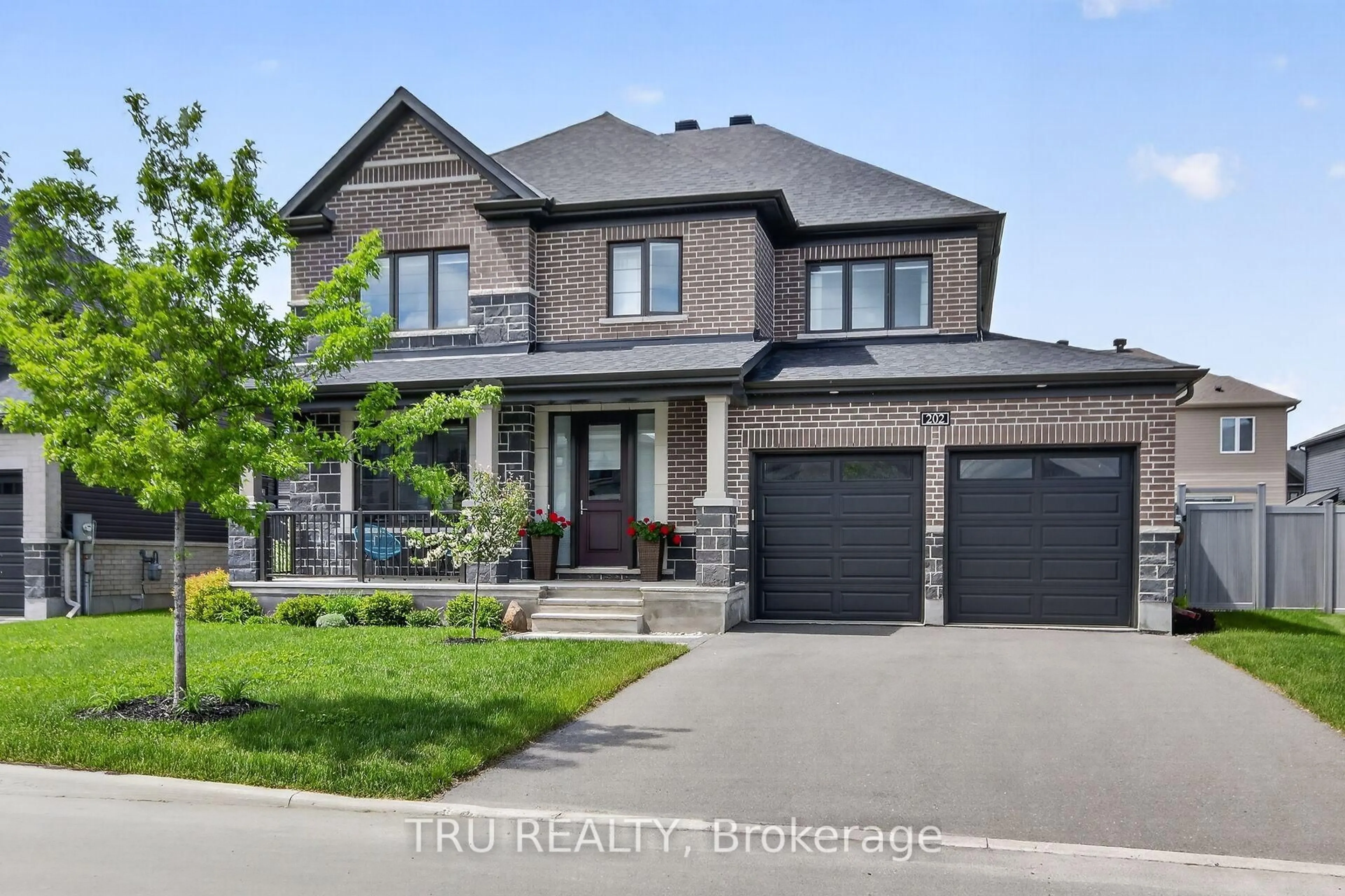 Home with brick exterior material, street for 202 Skipper Dr, Manotick Ontario K4M 0M5