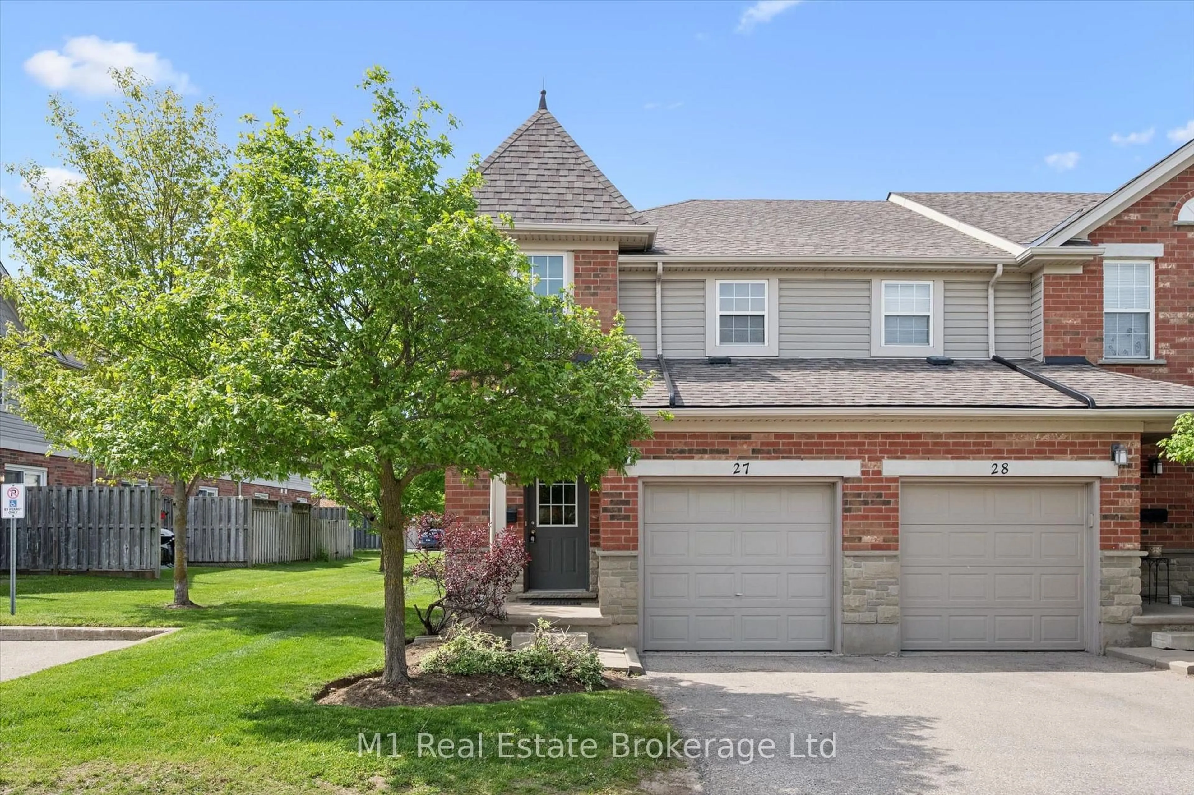 Home with brick exterior material, street for 124 Gosling Gdns #27, Guelph Ontario N1G 5K6