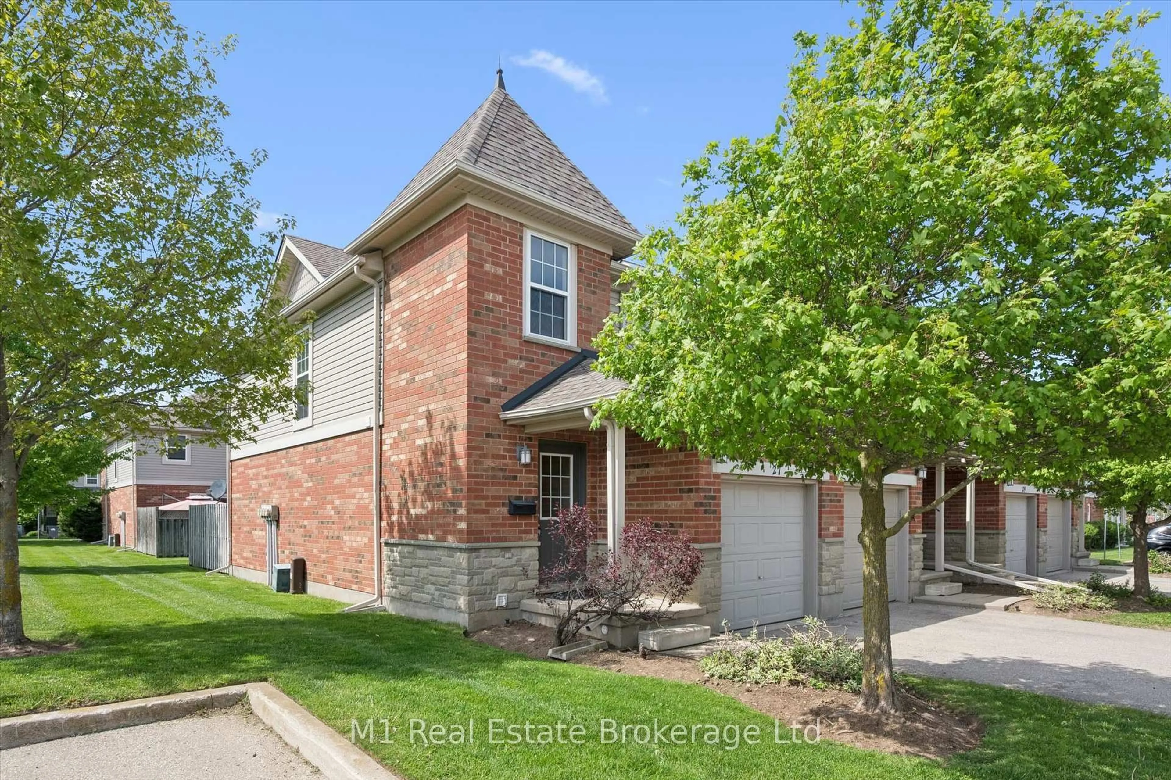 Home with brick exterior material, street for 124 Gosling Gdns #27, Guelph Ontario N1G 5K6