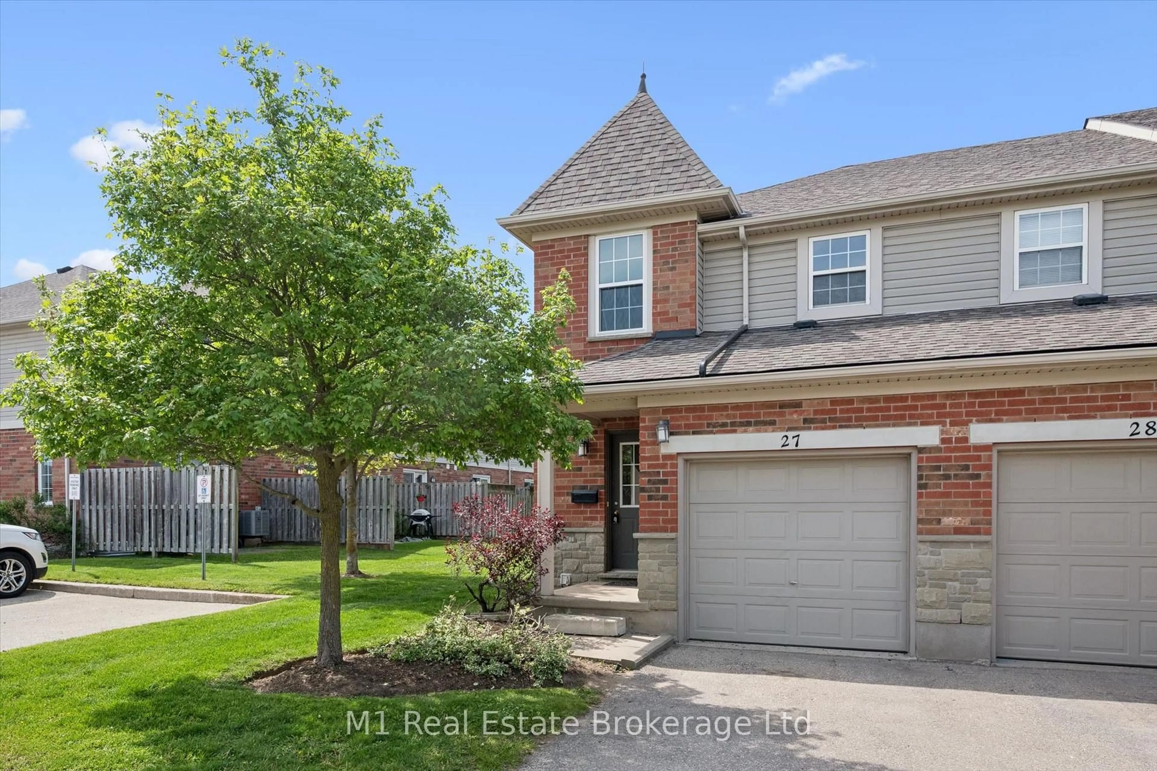 Home with brick exterior material, street for 124 Gosling Gdns #27, Guelph Ontario N1G 5K6