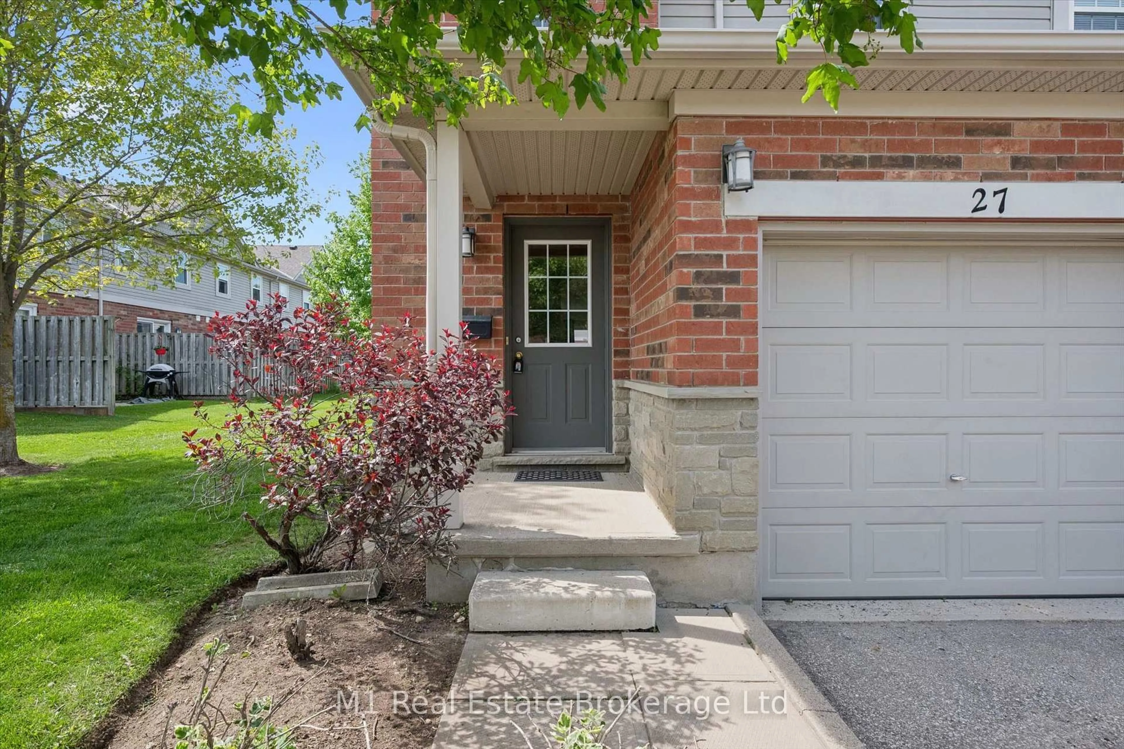 Home with brick exterior material, street for 124 Gosling Gdns #27, Guelph Ontario N1G 5K6