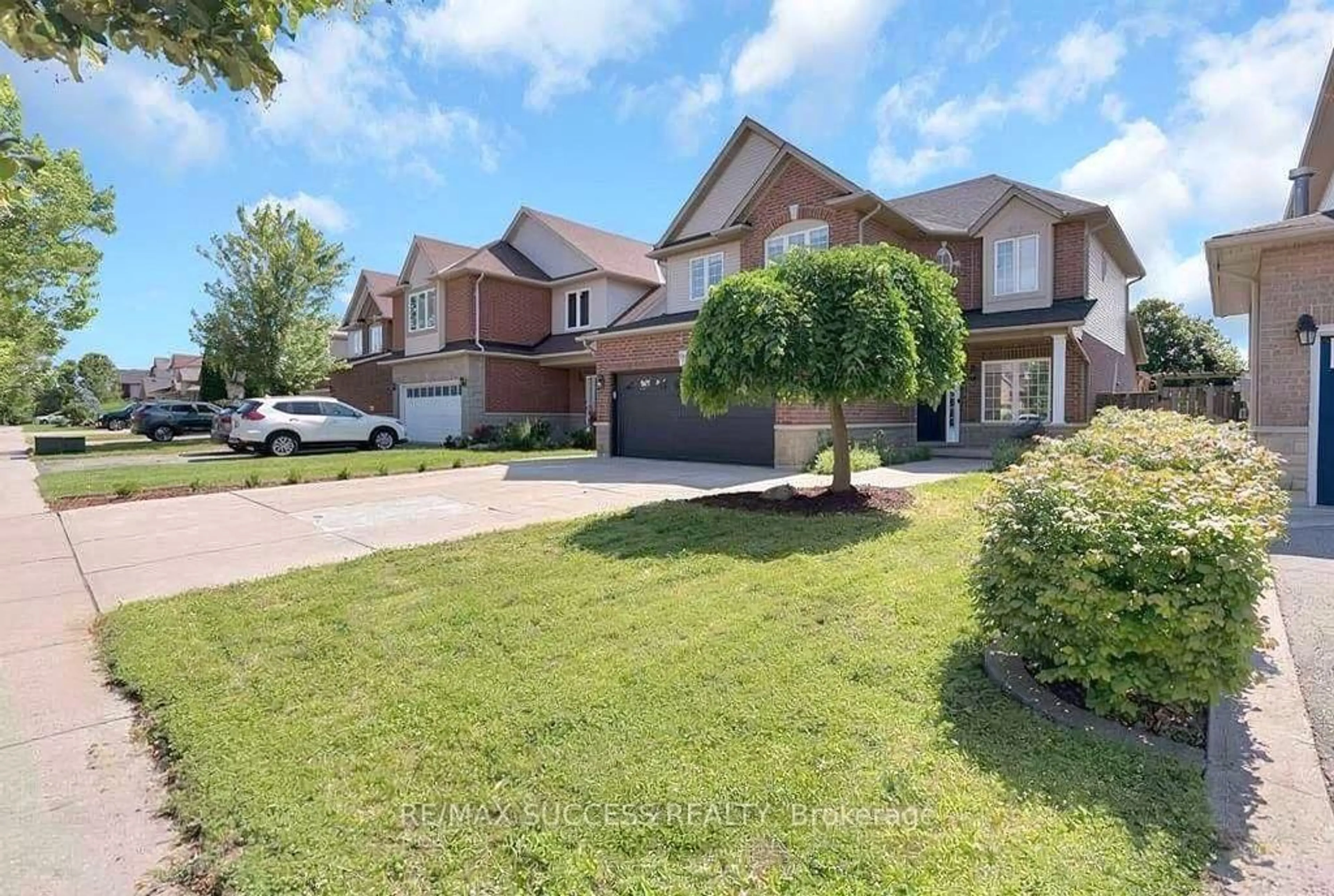 A pic from outside/outdoor area/front of a property/back of a property/a pic from drone, street for 64 Garth Trails Cres, Hamilton Ontario L9B 2X1
