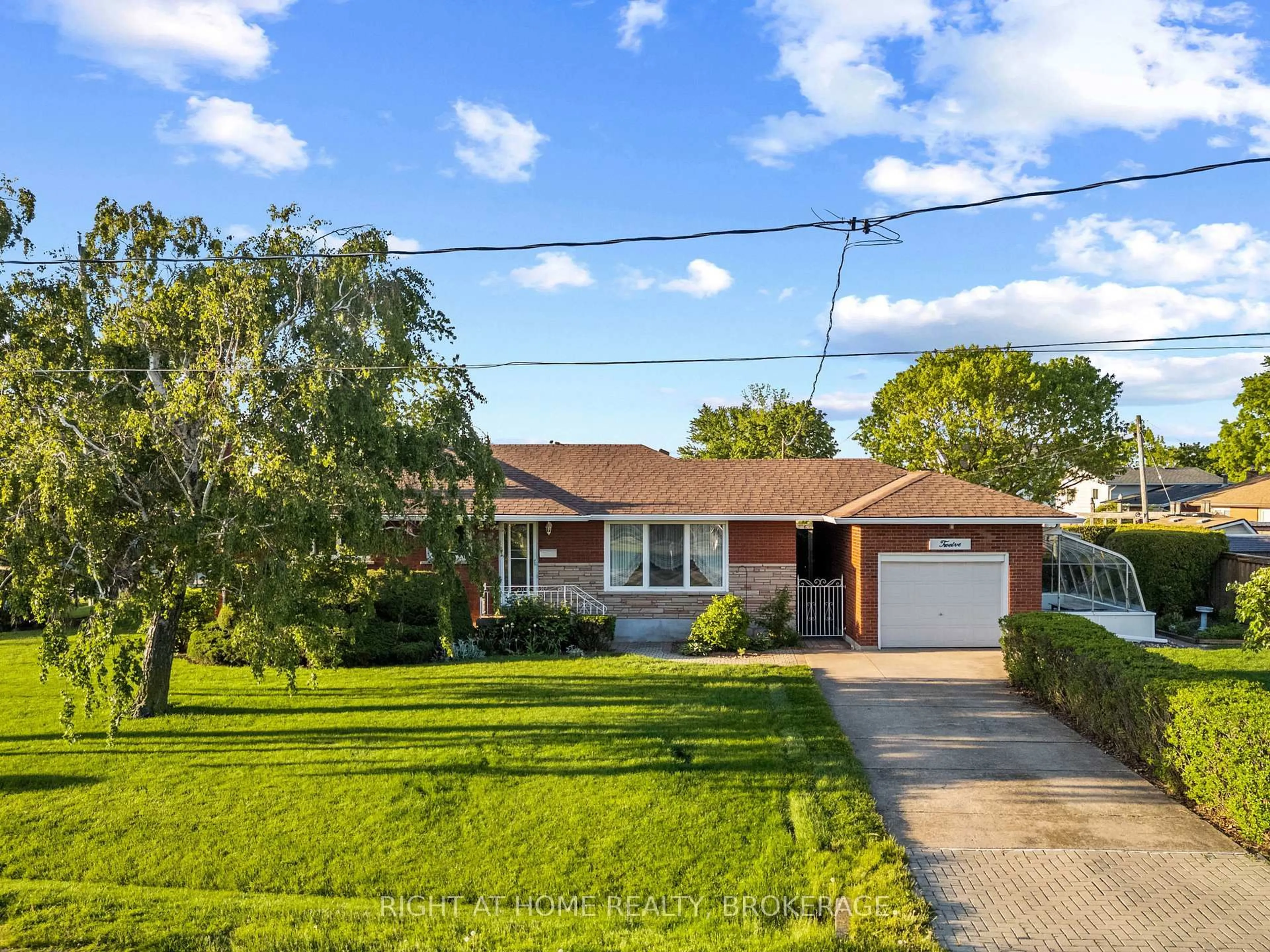 Home with vinyl exterior material, street for 12 Lorne Ave, Grimsby Ontario L3M 2H5