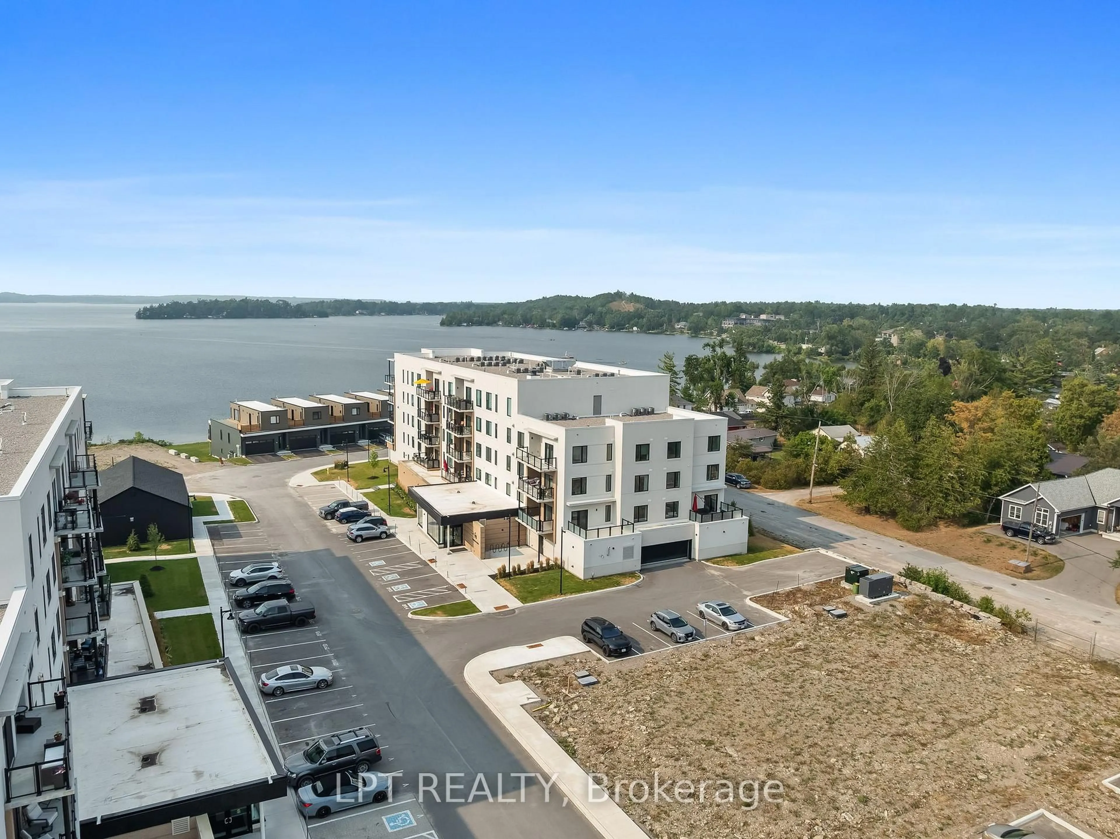 A pic from outside/outdoor area/front of a property/back of a property/a pic from drone, water/lake/river/ocean view for 19B West St #402, Kawartha Lakes Ontario K0M 1N0