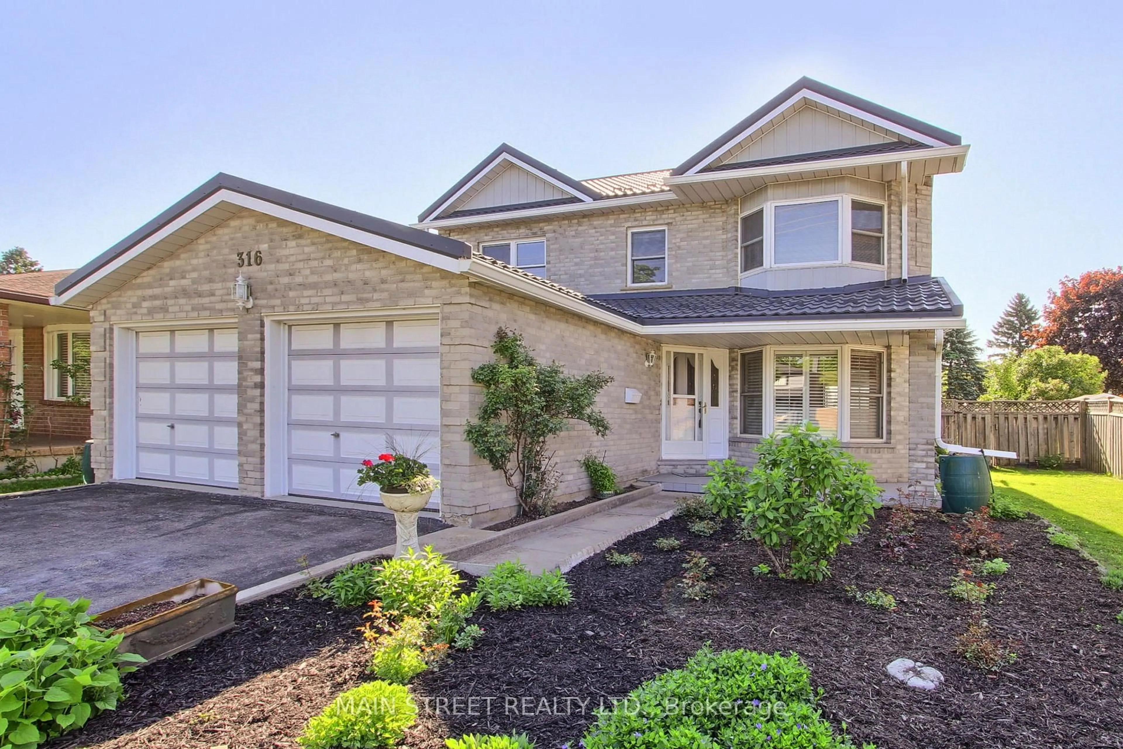 Home with brick exterior material, street for 316 Biehn Dr, Kitchener Ontario N2R 1C7