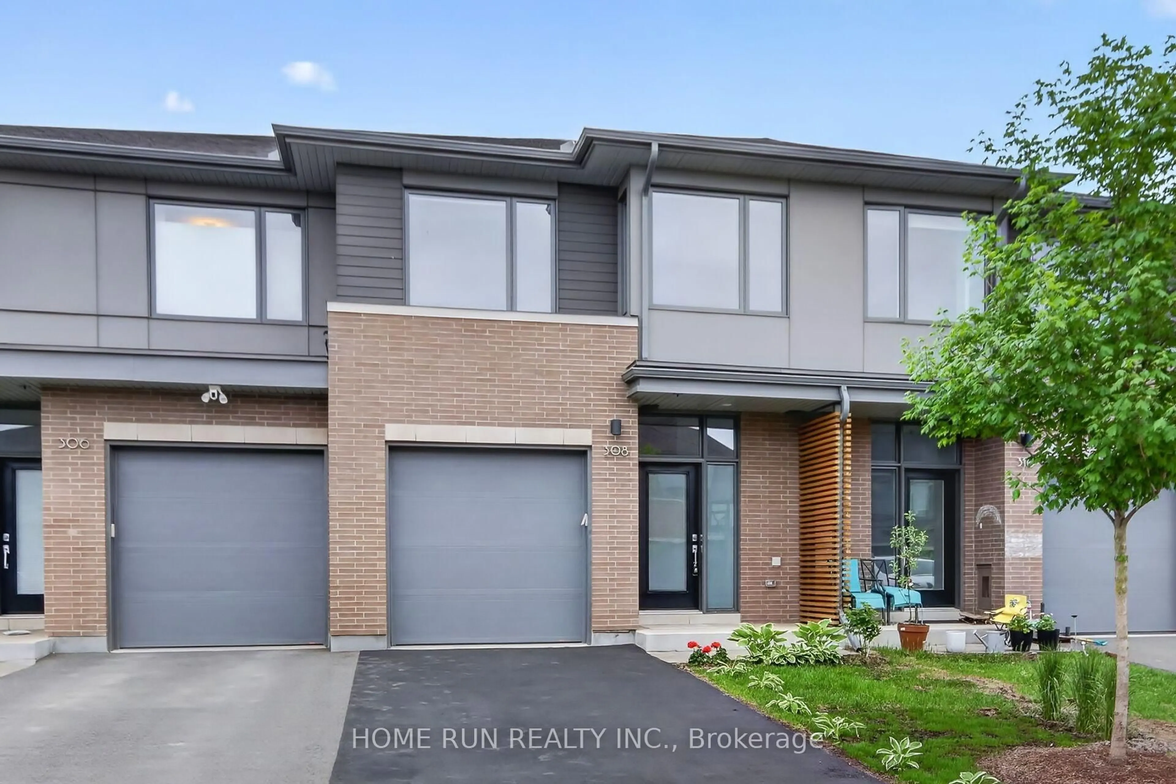 Home with brick exterior material, street for 308 WIGWAS St, Ottawa Ontario K1K 5A1