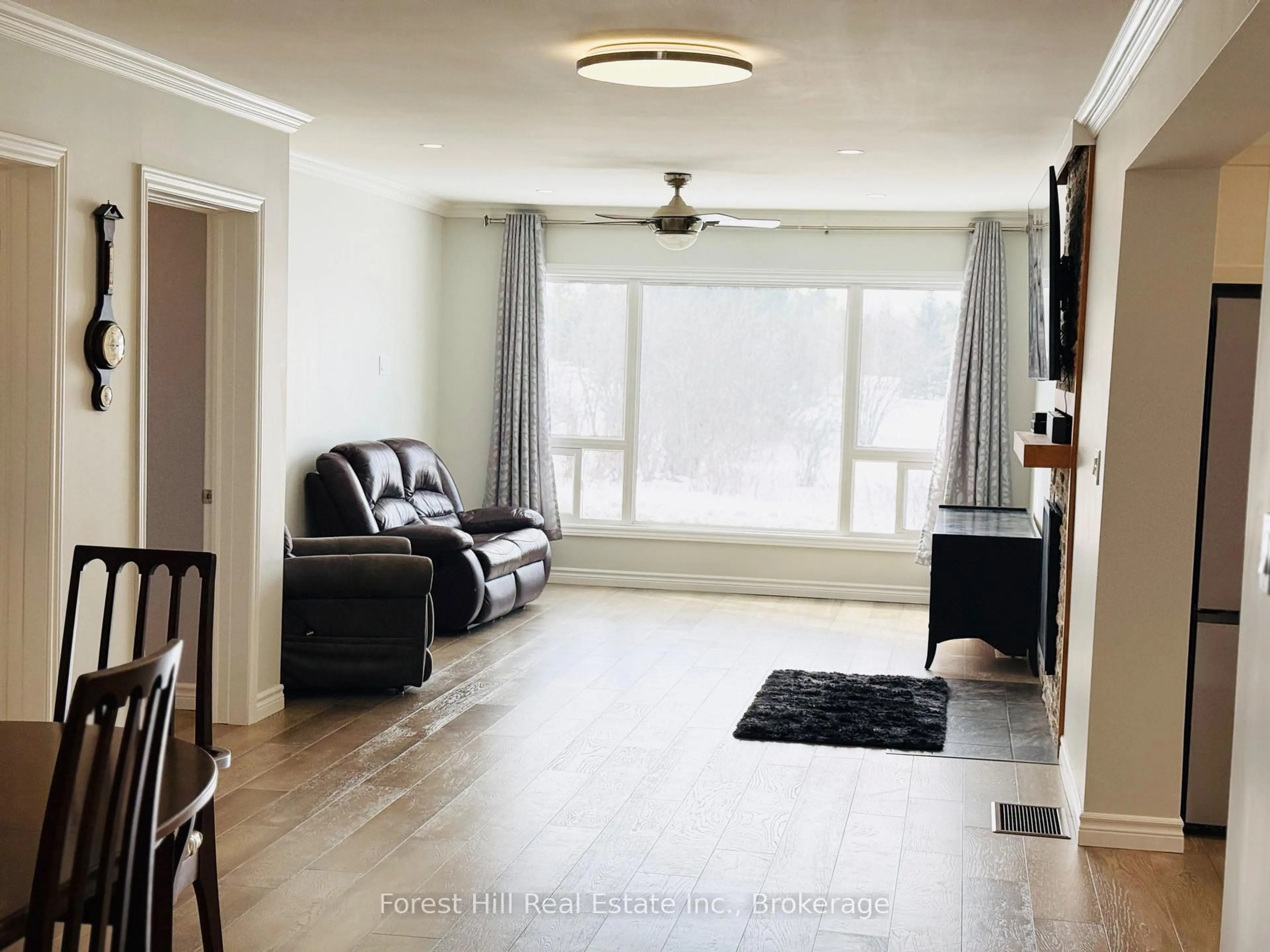 Living room with furniture, wood/laminate floor for 11946 Hwy 522 Highway, Parry Sound Remote Area Ontario P0H 1S0