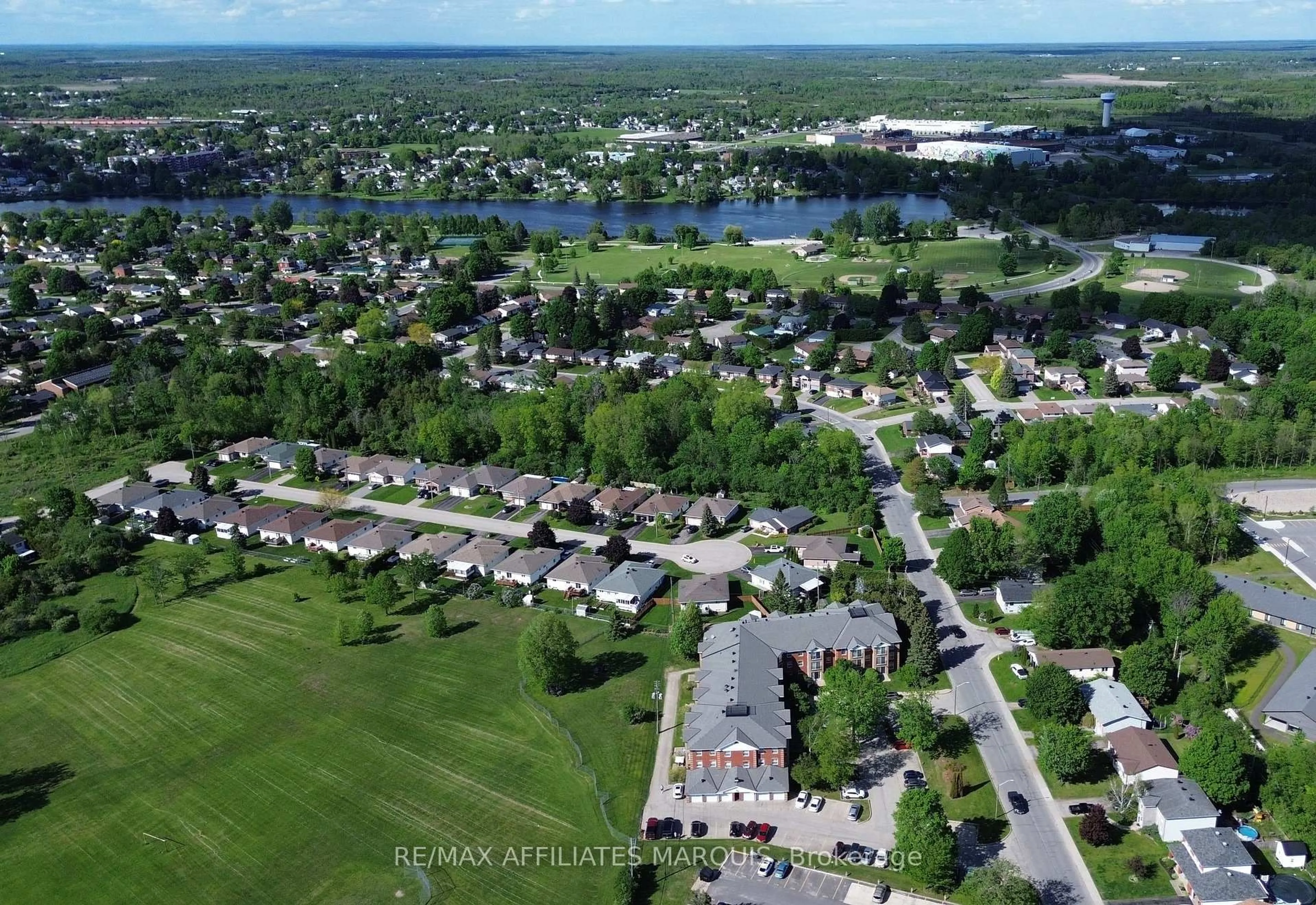 A pic from outside/outdoor area/front of a property/back of a property/a pic from drone, water/lake/river/ocean view for 40 Pearl St #115, Smiths Falls Ontario K7A 5B5