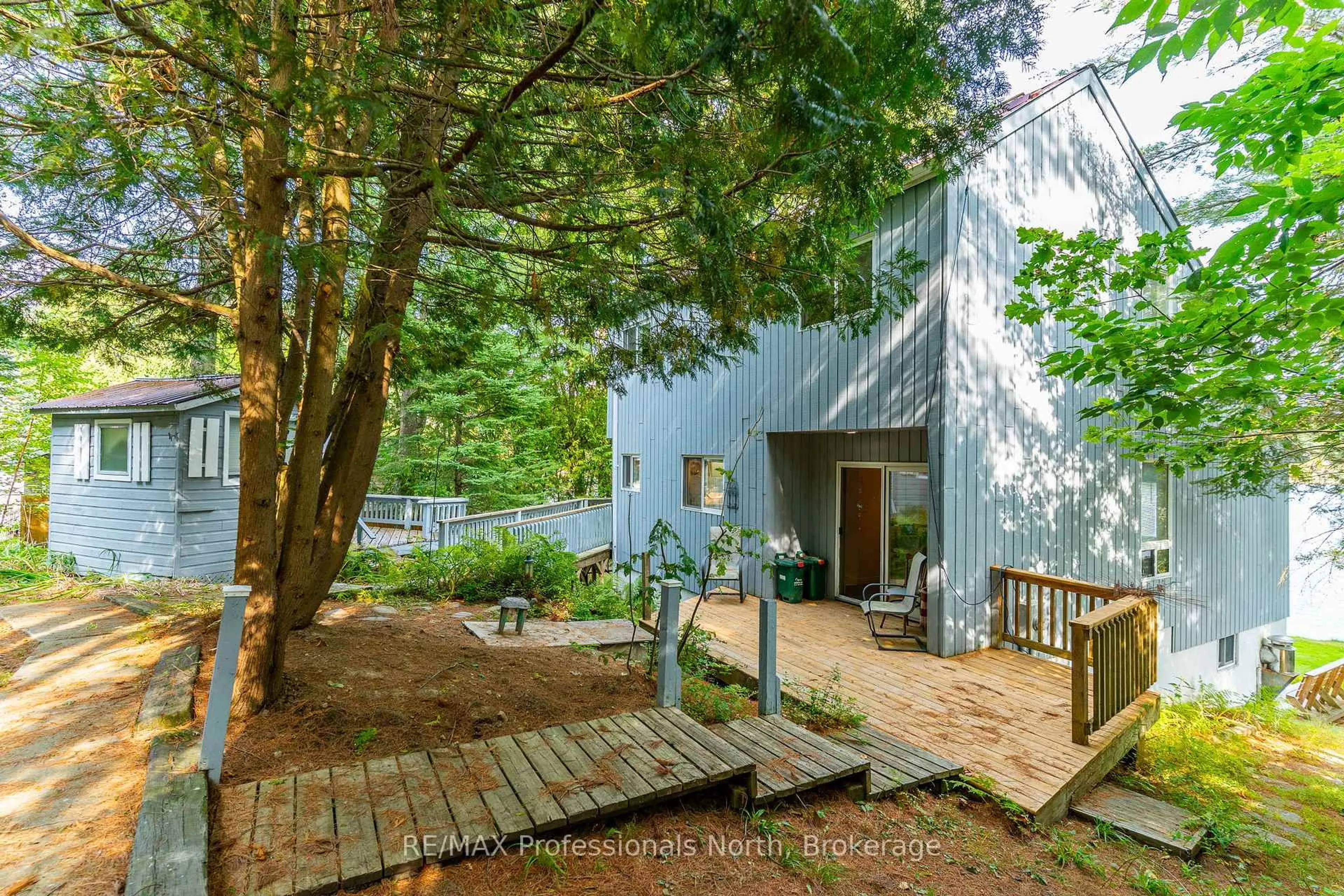 A pic from outside/outdoor area/front of a property/back of a property/a pic from drone, forest/trees view for 1080 Petticoat Lane, Minden Hills Ontario K0M 2K0