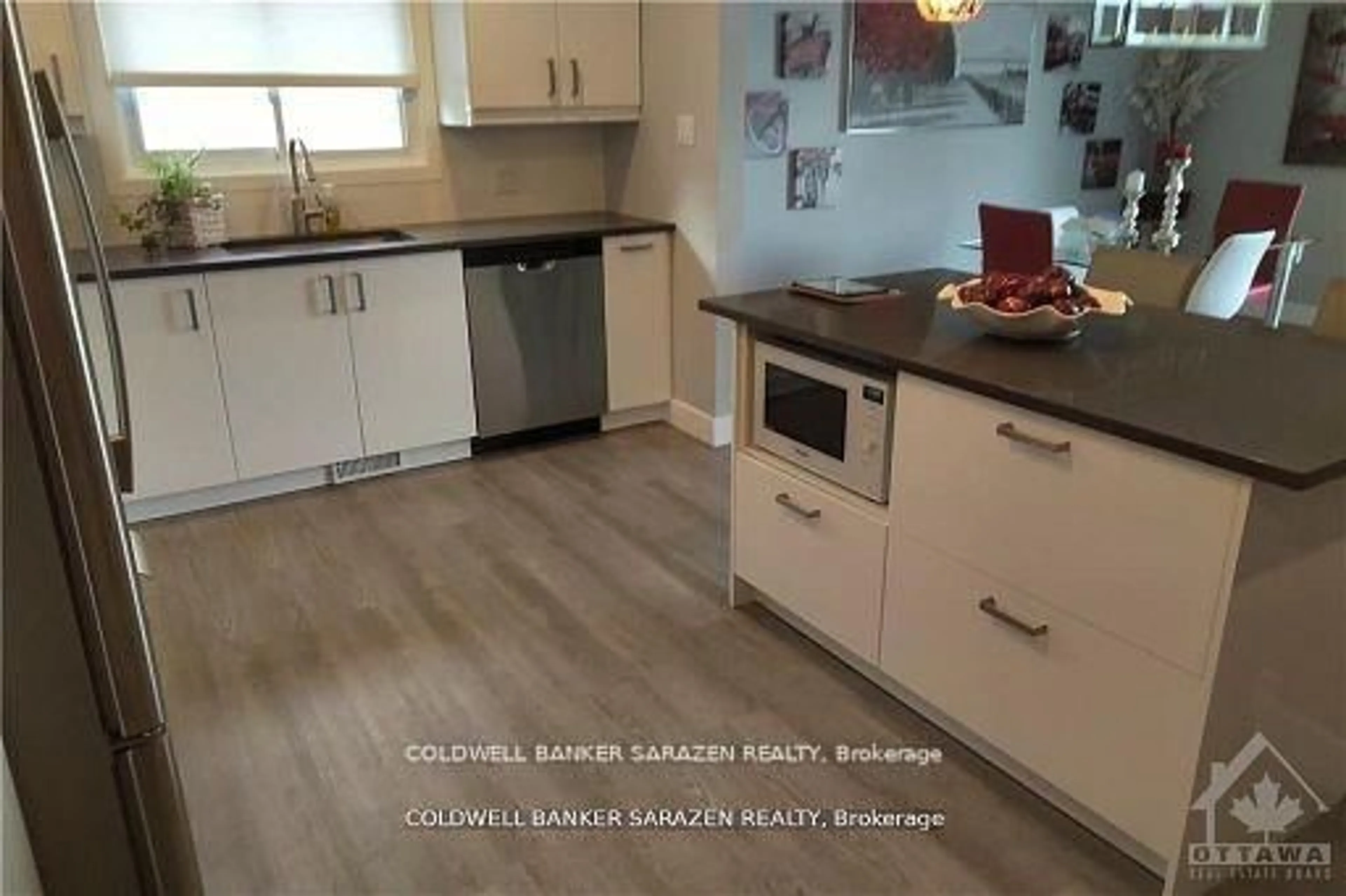 Open concept kitchen, wood/laminate floor for 860 CONNAUGHT Ave, Ottawa Ontario K2B 5M6