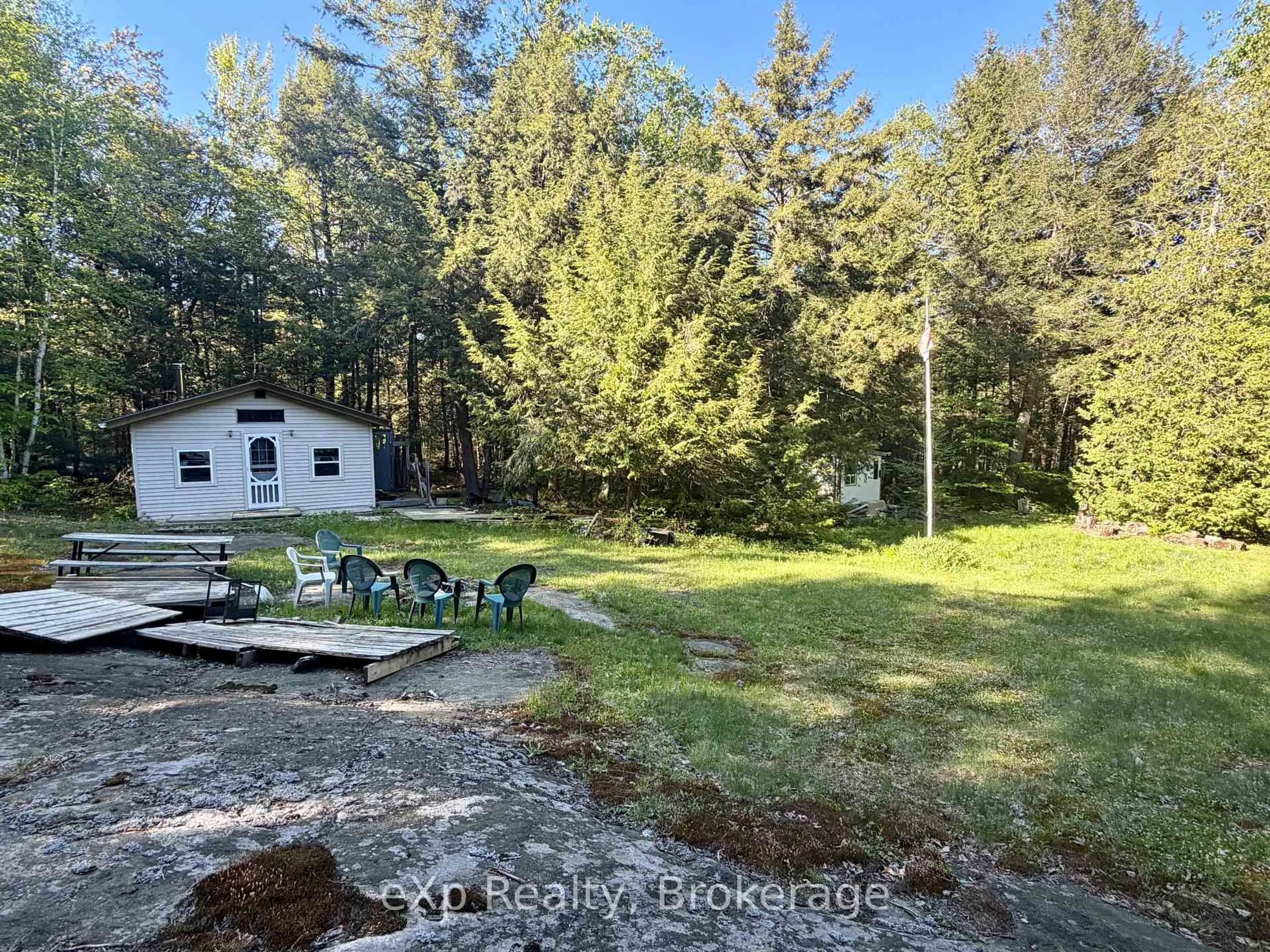 A pic from outside/outdoor area/front of a property/back of a property/a pic from drone, forest/trees view for 1080 Milne Rd, Bracebridge Ontario P1L 1X1