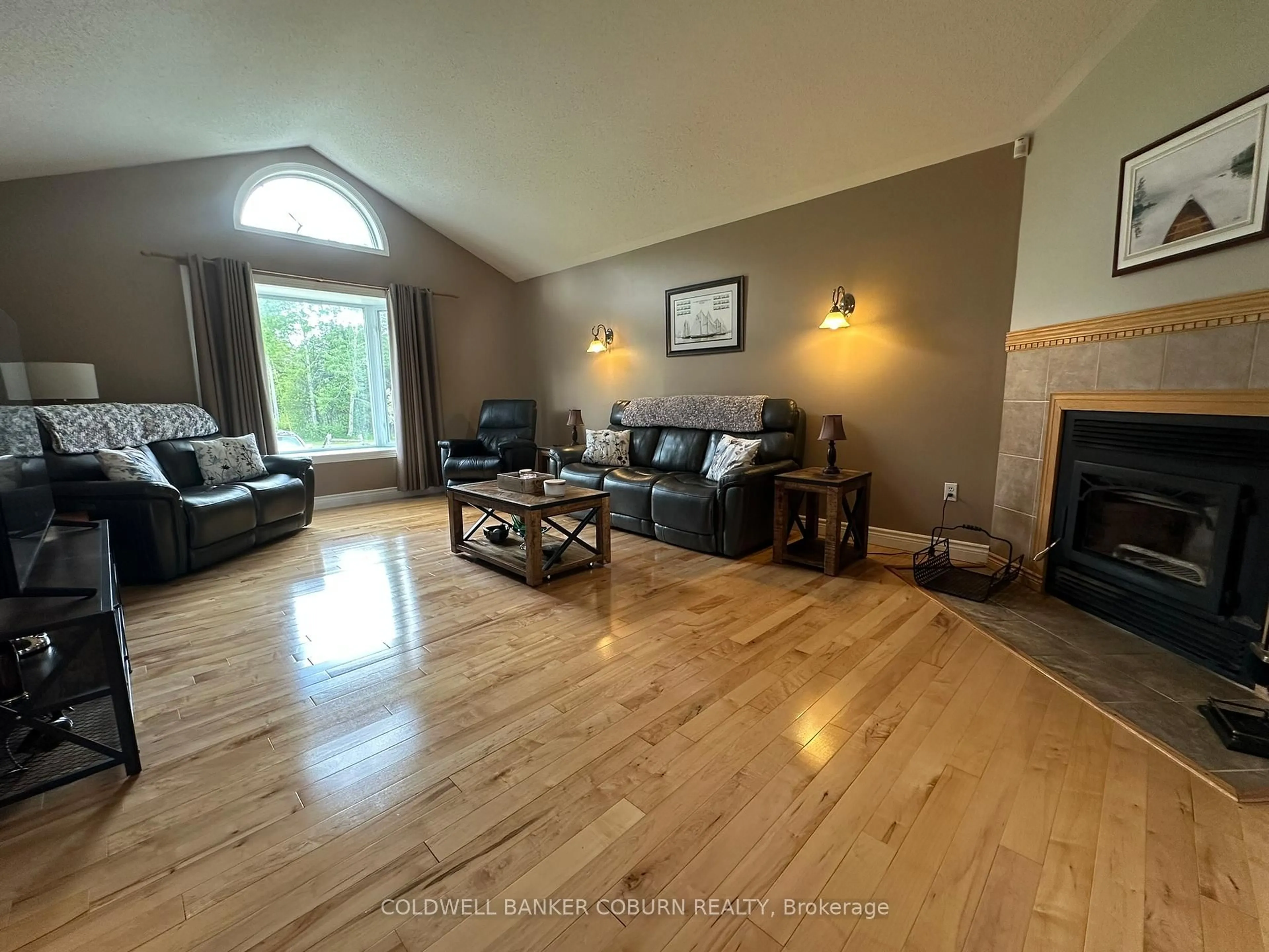 Living room with furniture, wood/laminate floor for 2480 Beach Rd, North Grenville Ontario K0G 1T0