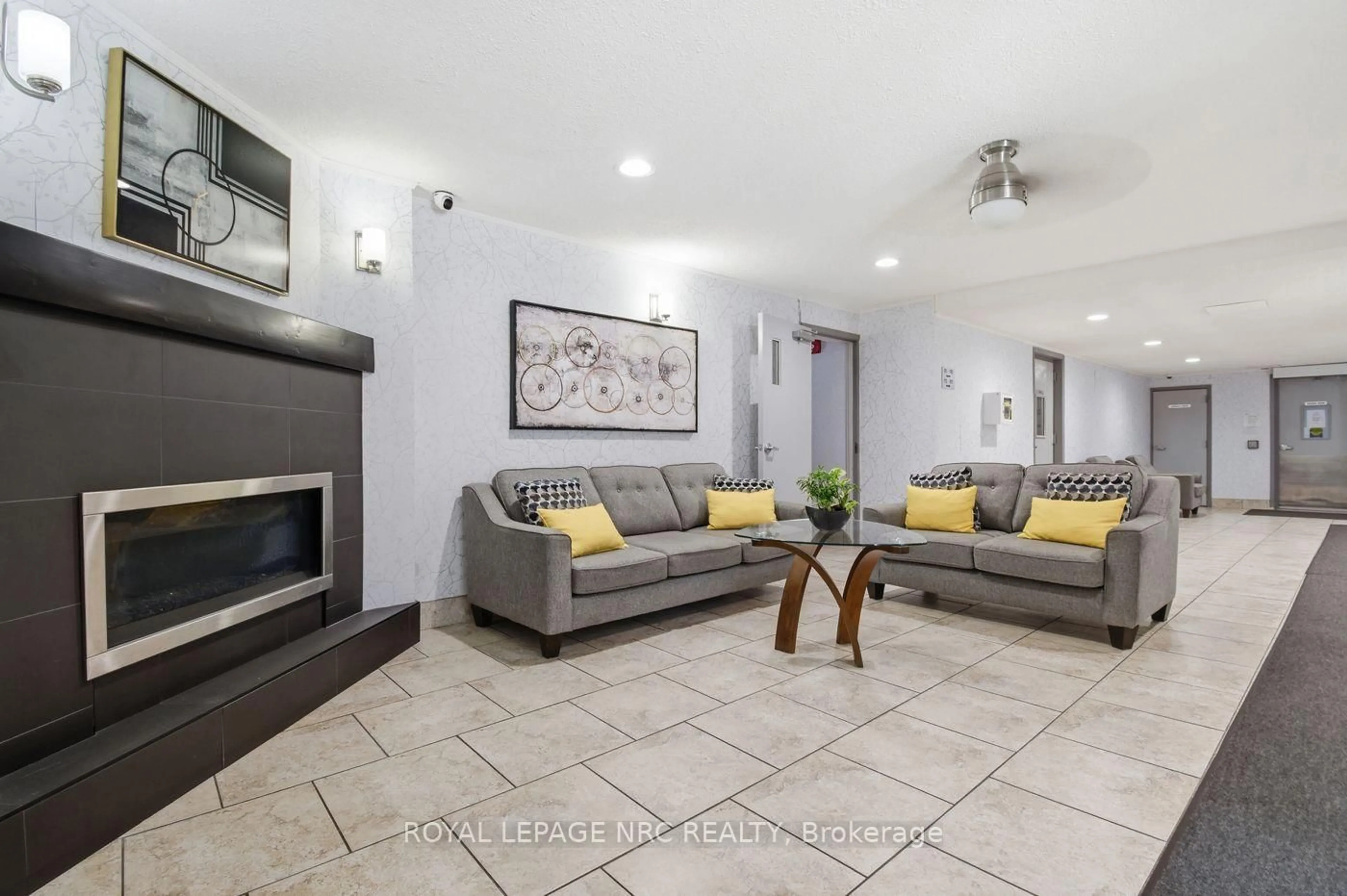 Living room with furniture, ceramic/tile floor for 198 Scott St #117, St. Catharines Ontario L2N 5T3