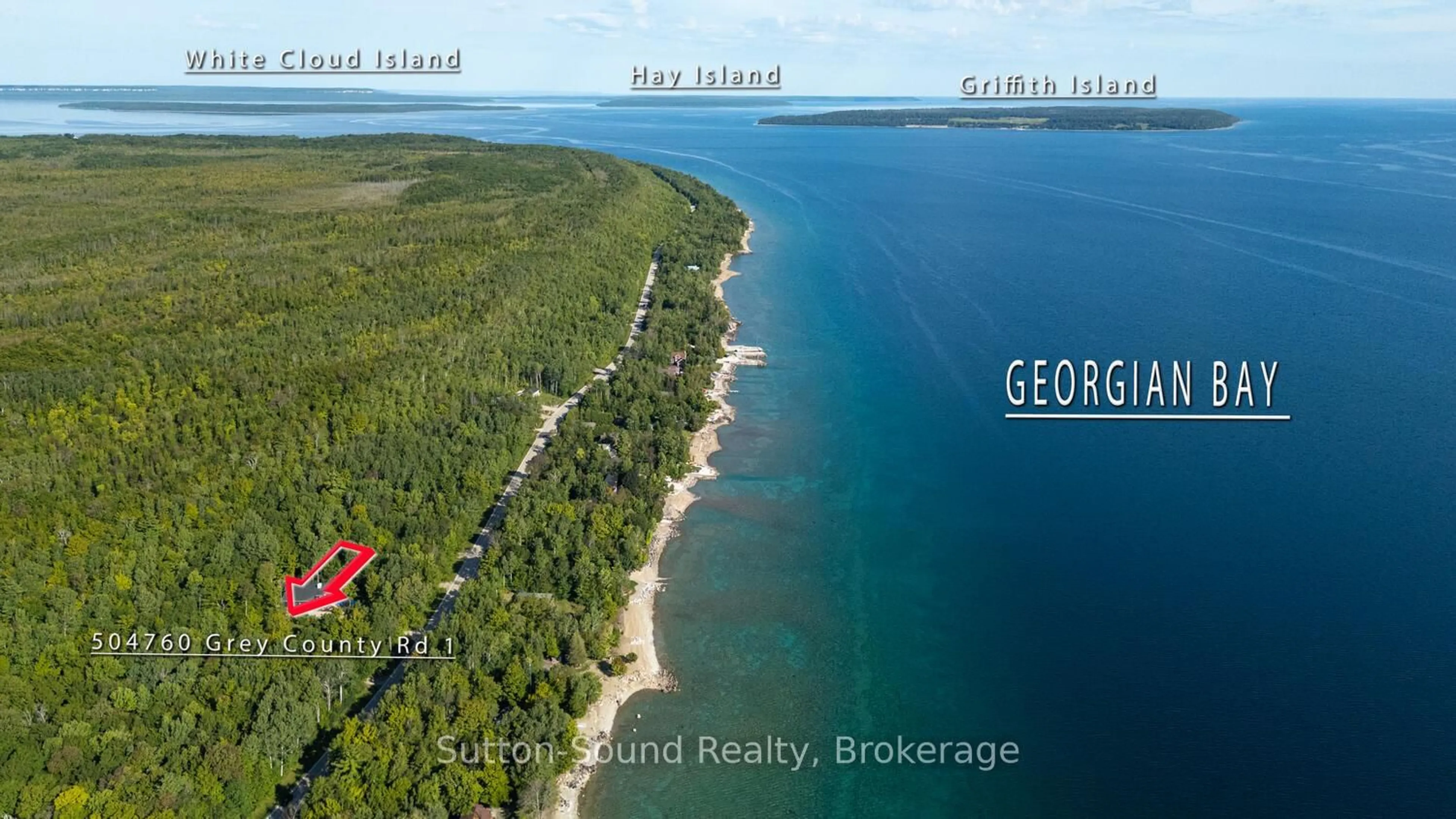 A pic from outside/outdoor area/front of a property/back of a property/a pic from drone, water/lake/river/ocean view for 504760 Grey Road 1, Georgian Bluffs Ontario N0H 1S0