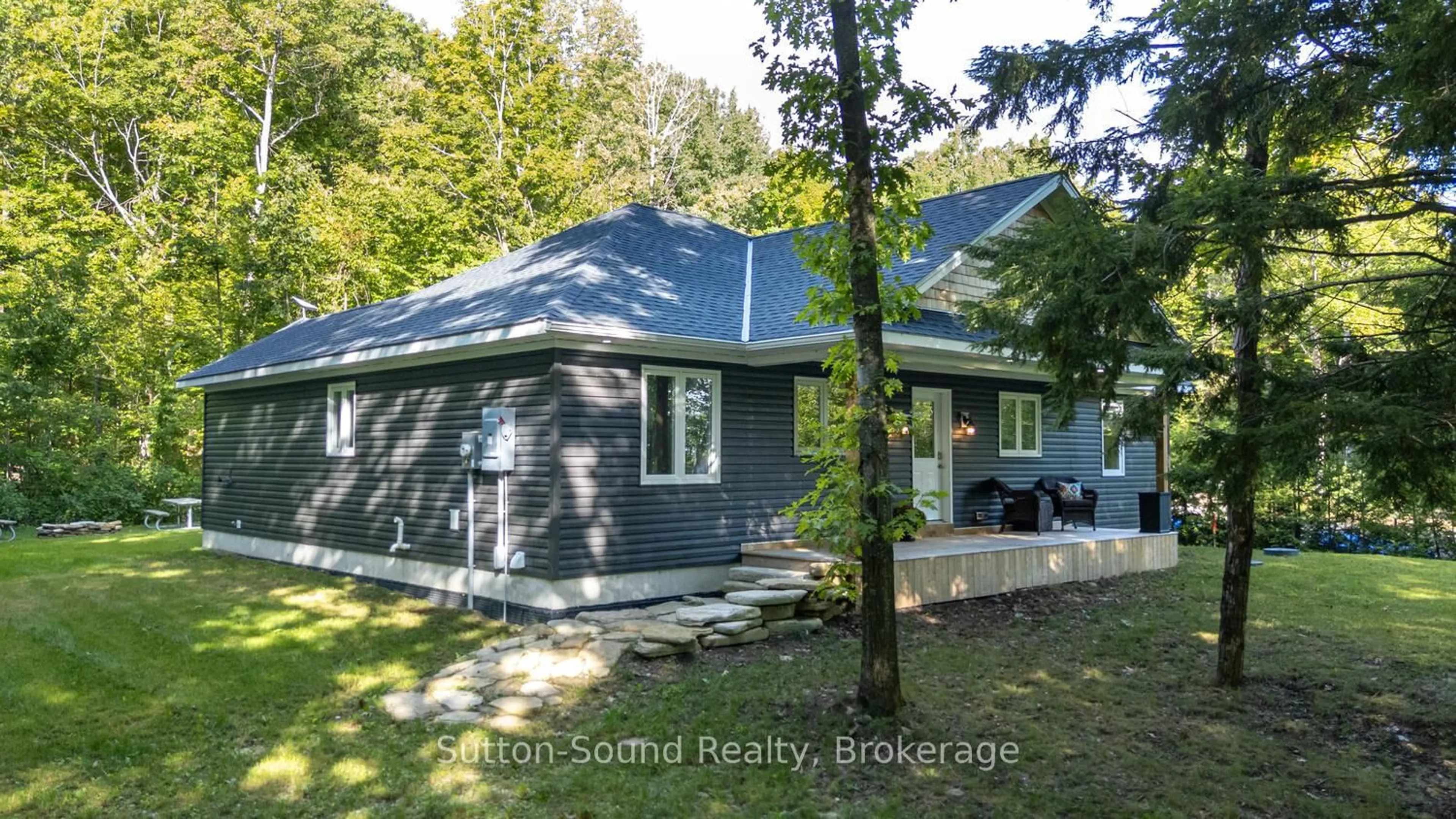 A pic from outside/outdoor area/front of a property/back of a property/a pic from drone, unknown for 504760 Grey Road 1, Georgian Bluffs Ontario N0H 1S0