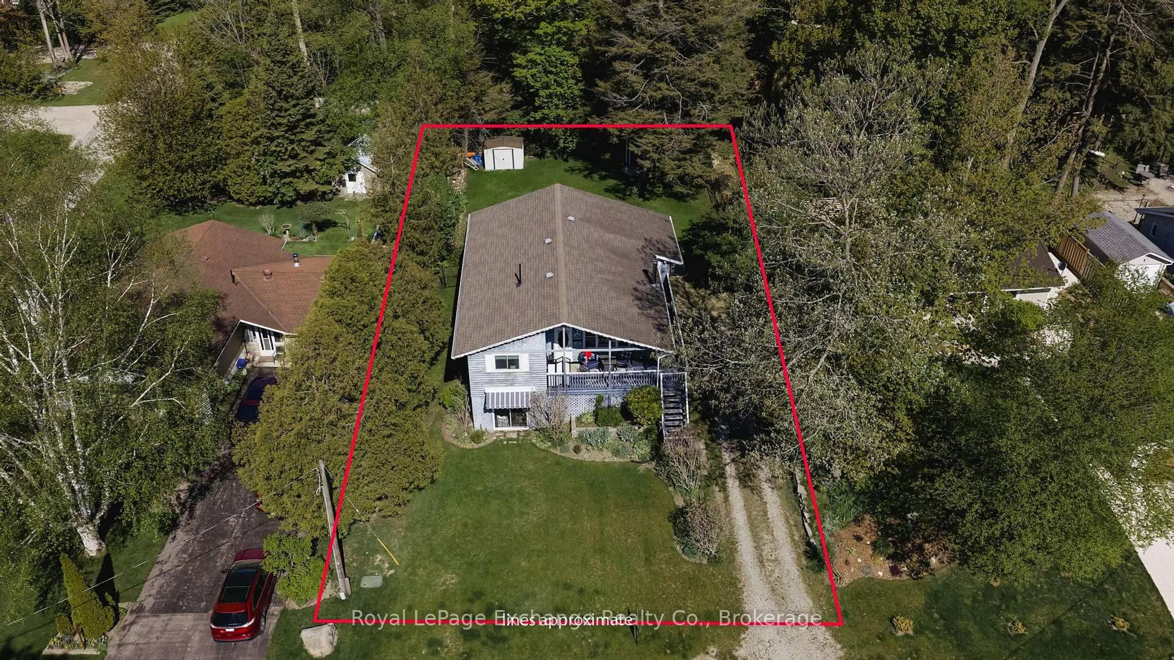 A pic from outside/outdoor area/front of a property/back of a property/a pic from drone, street for 105 Menomini Rd, Huron-Kinloss Ontario N2Z 2X3