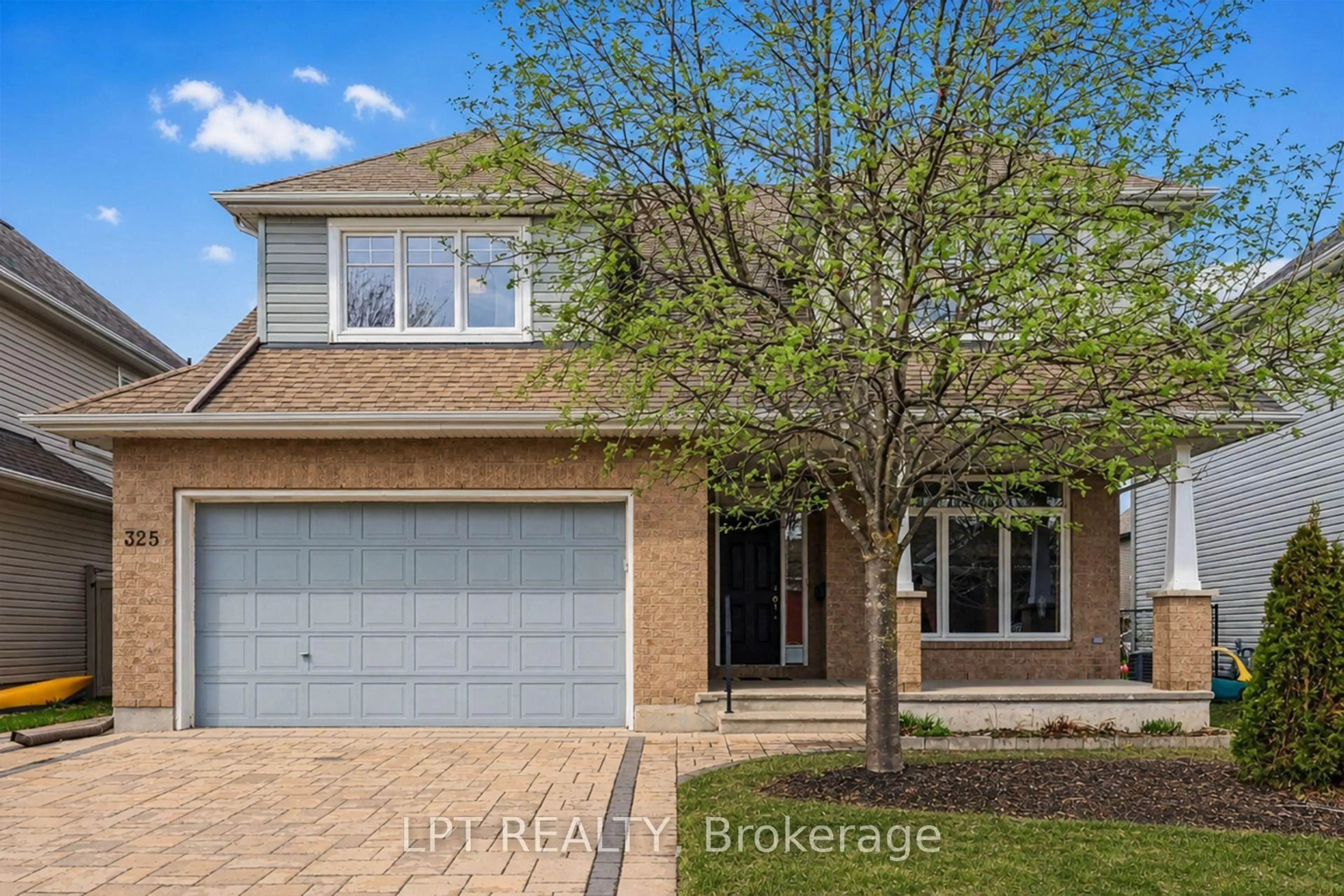 Home with brick exterior material, street for 325 Creston Valley Way, Ottawa Ontario K1T 0G6
