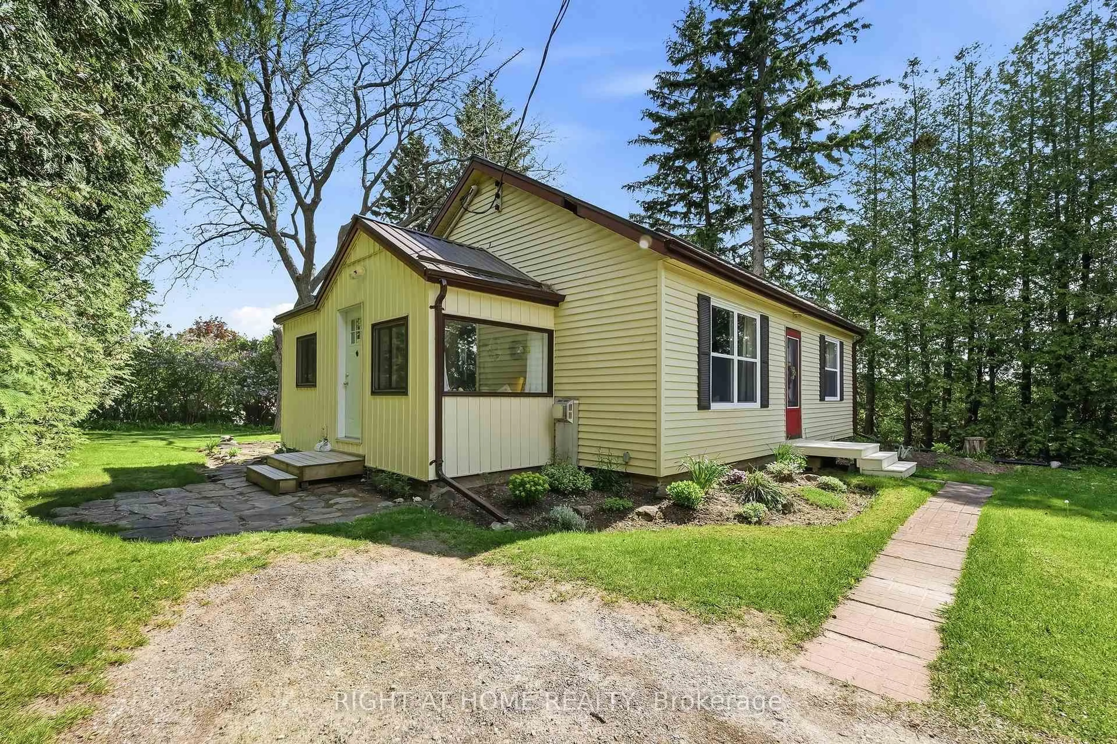 Home with vinyl exterior material, street for 8601 Lander Rd, Hamilton Township Ontario K0K 2E0