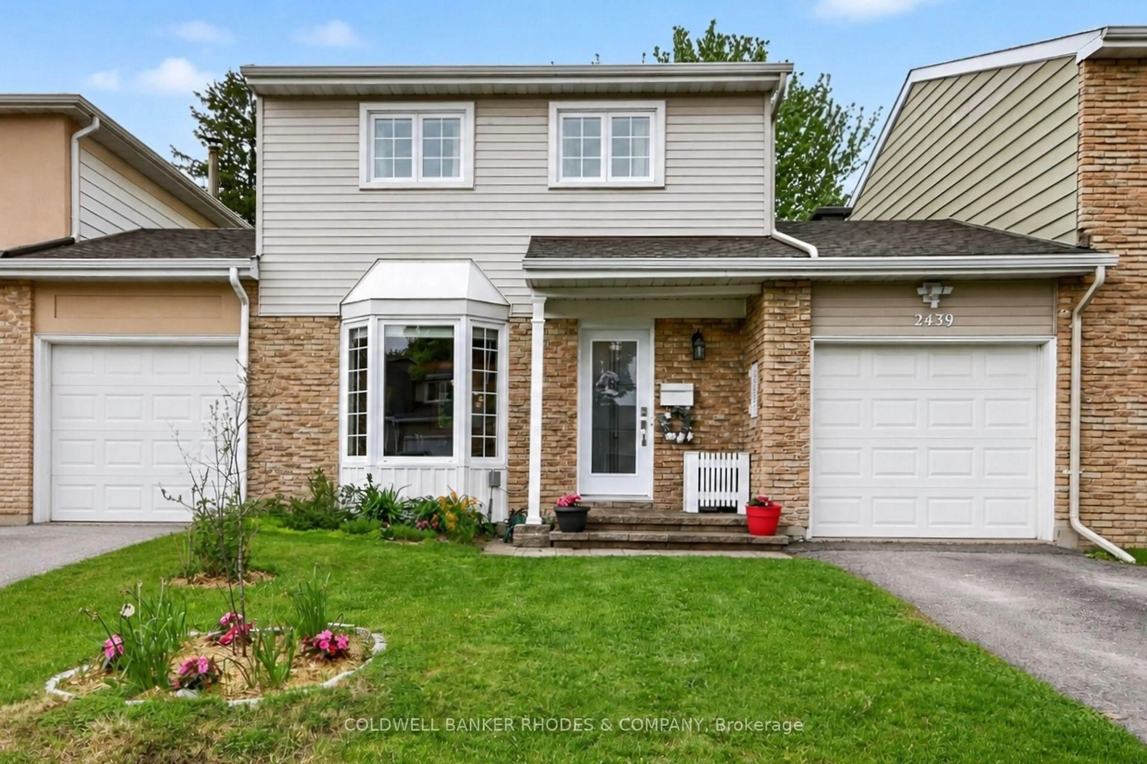 Home with vinyl exterior material, street for 2439 Autumn Hill Cres, Ottawa Ontario K1B 4M6