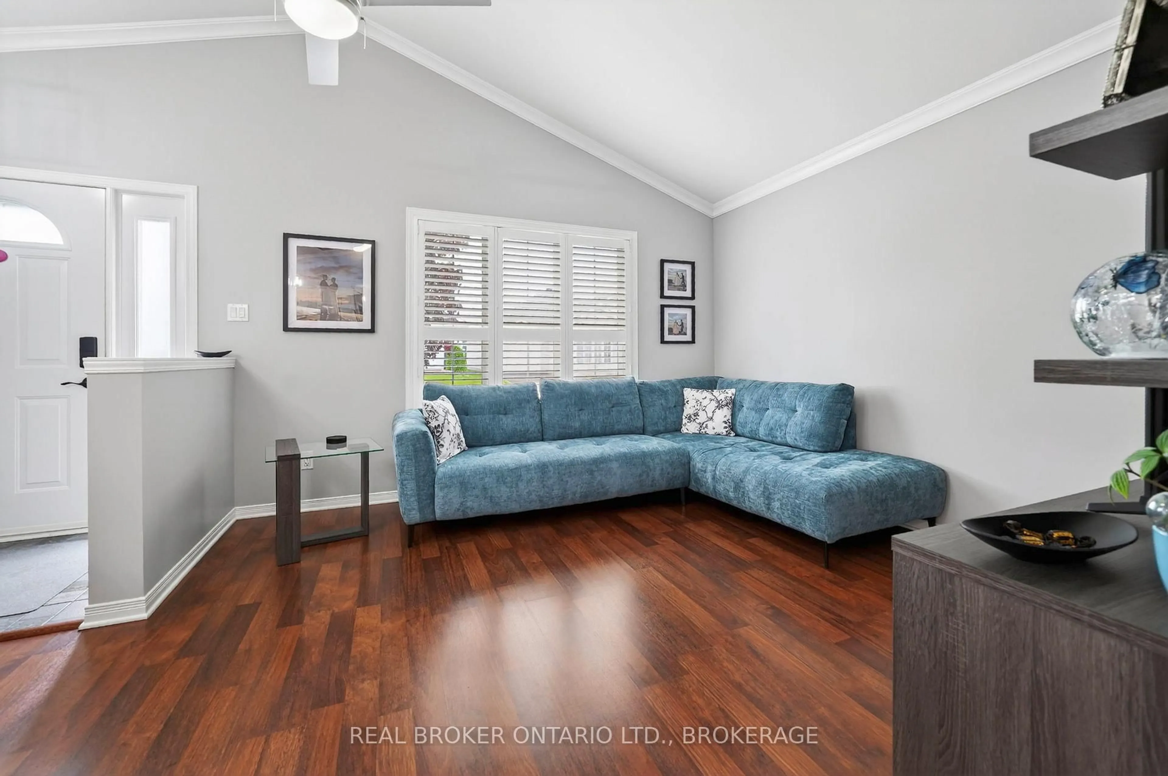Living room with furniture, wood/laminate floor for 1526 Frank Crt, Cornwall Ontario K6H 7N7