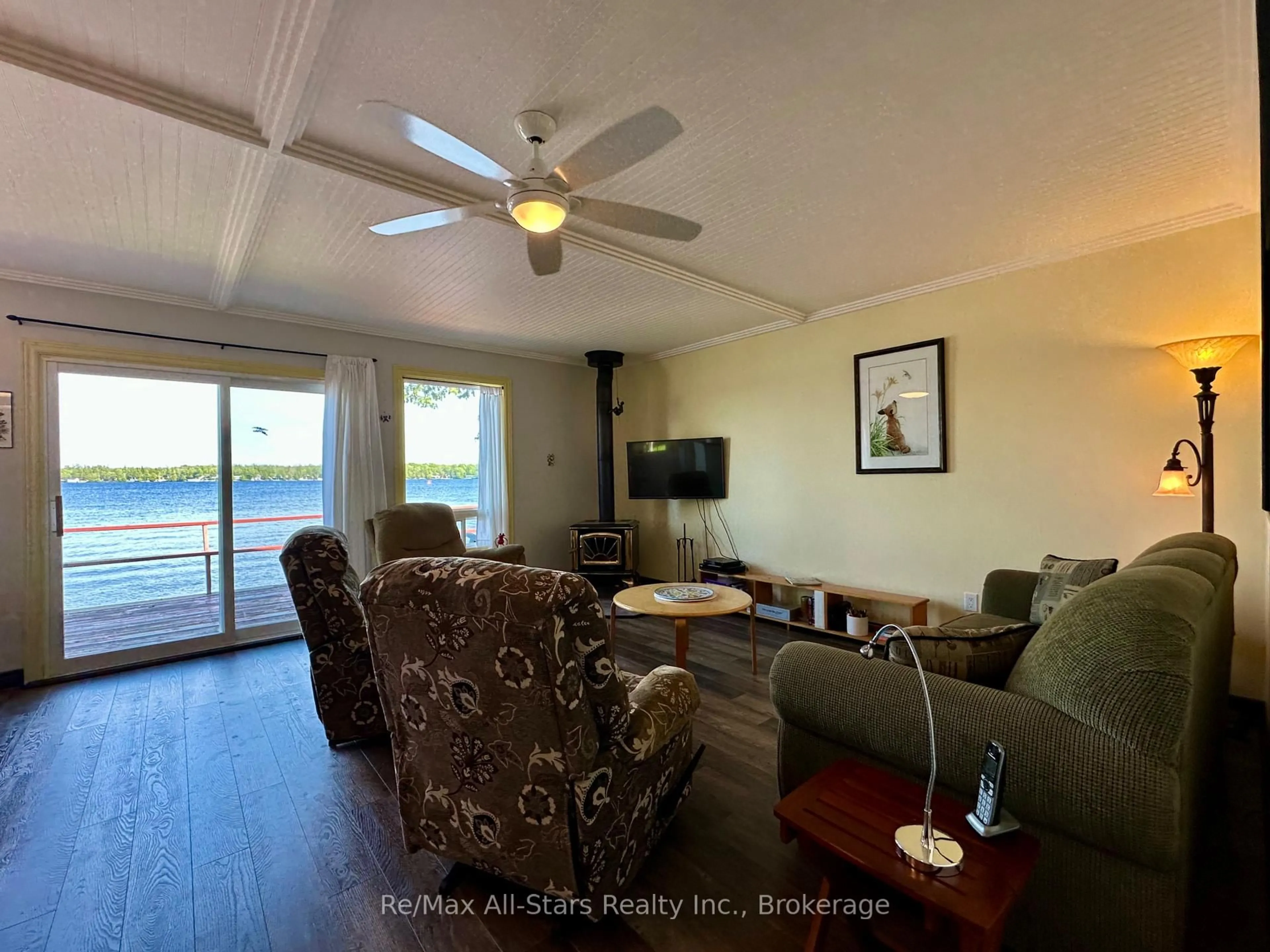Living room with furniture, wood/laminate floor for 700 Grand Island Rd, Kawartha Lakes Ontario K0M 1N0