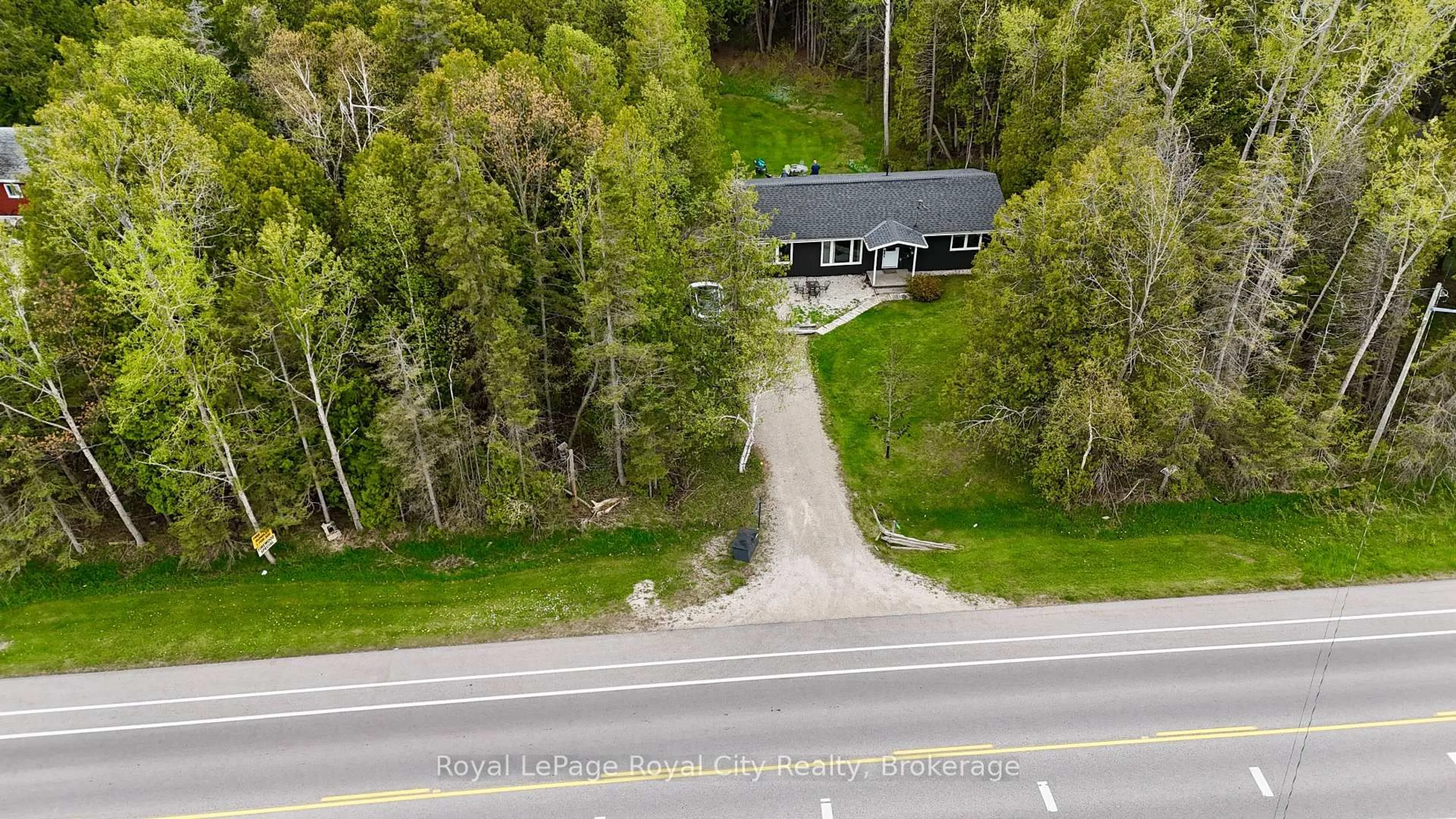 A pic from outside/outdoor area/front of a property/back of a property/a pic from drone, street for 7221 6 Highway, Northern Bruce Peninsula Ontario N0H 2R0