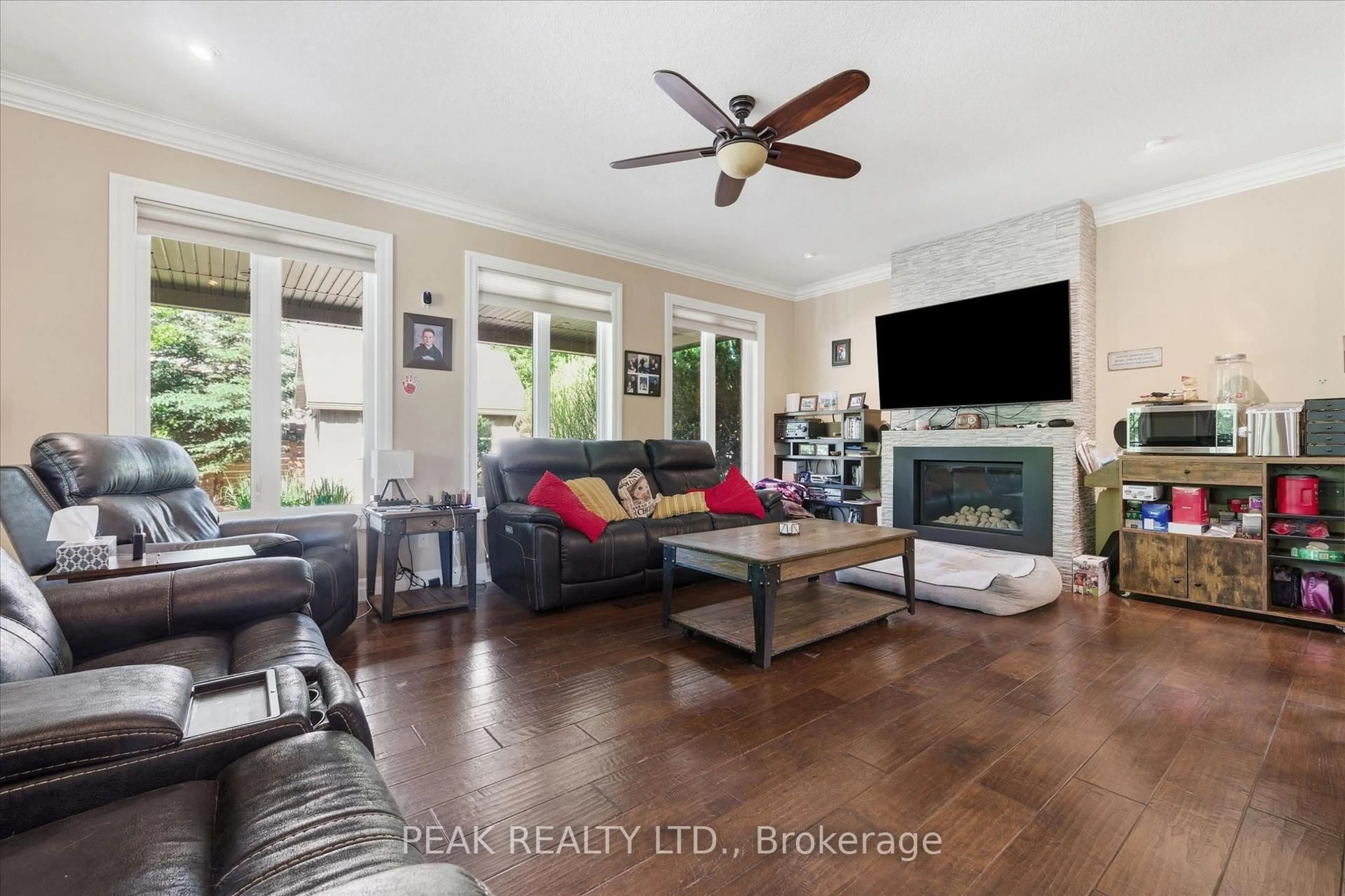 Living room with furniture, wood/laminate floor for 901 Valebrook Crt, Kitchener Ontario N2A 0E5